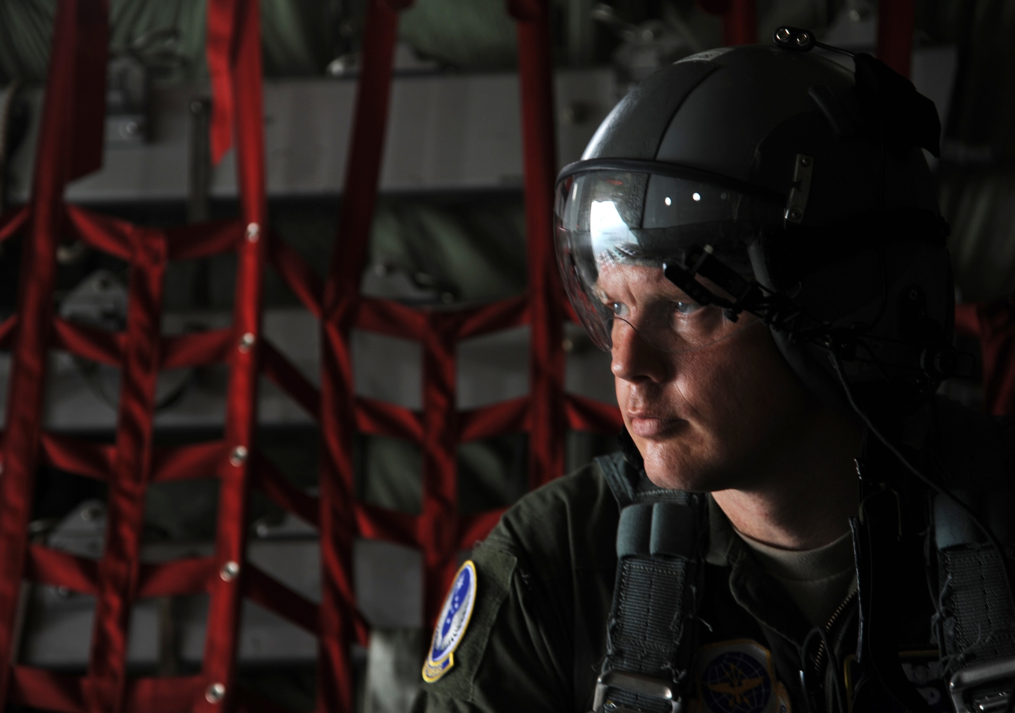 DOUALA, CAMEROON – U.S. Air Force Technical Sgt. Joshua Tippy, a C-130 loadmaster air advisor assigned to the 818th Mobility Support Advisory Squadron, Joint Base McGuire-Dix-Lakehurst, N.J., looks on as a safety observer during a Cameroon Air Force C-130 low-cost low-altitude bundle air drop during Central Accord 2013, at Douala Air Force Base, Douala, Cameroon, February 26, 2013. Tippy is participating in Central Accord 2013, a joint exercise in which U.S., Cameroon and neighboring Central African militaries partner to promote regional cooperation while and increasing aerial resupply and medical readiness capacity. (Photo by Master Sgt. MSgt Stan Parker, 621st CRW Public Affairs)