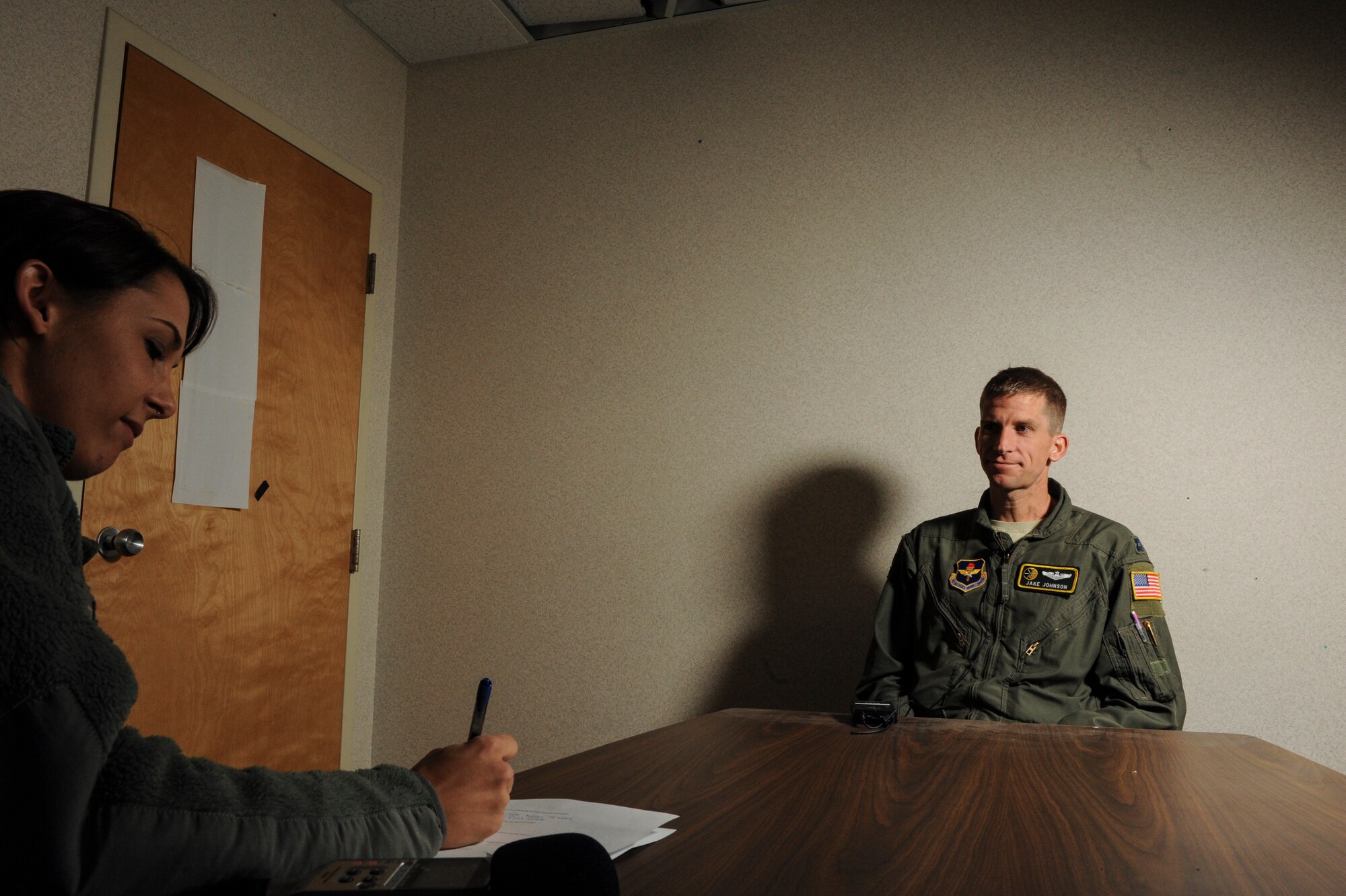 Staff Sgt. Jessica Condit, a 19th Airlift Wing photojournalist, interviews Capt. Jake Johnson, a 48th Airlift Squadron flight commander and pilot, for the Little Rock Snapshot Feb. 26, 2013 at Little Rock Air Force Base, Ark. Johnson was selected to represent the United States Air Force at the 2013 Conseil International du Sport Militaire Cross Country Championship, March 13-18, in Apatin, Serbia.(U.S. Air Force photo by Airman 1st Class Scott Poe)