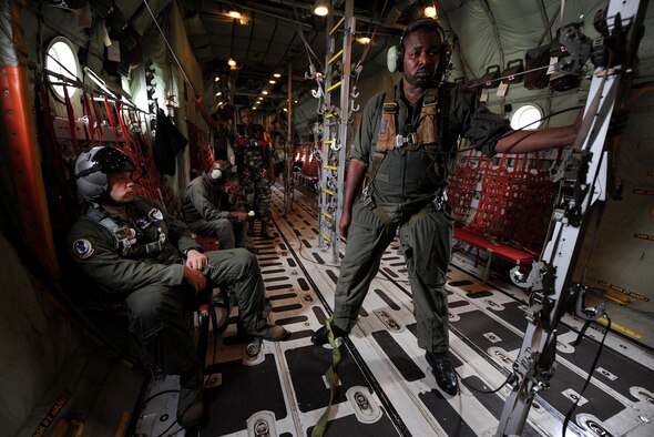 Tech. Sgt. Joshua Tippy, a C-130 loadmaster air advisor assigned to the 818th Mobility Support Advisory Squadron, Joint Base McGuire-Dix-Lakehurst, N.J., prepares to ride as a safety observer during a Cameroon air force C-130 low-cost low-altitude bundle air drop during Central Accord 2013, at Douala Air Force Base, Douala, Cameroon, February 28, 2013. Tippy is participating in Central Accord 2013, a joint exercise in which U.S., Cameroon and neighboring Central African militaries partner to promote regional cooperation while and increasing aerial resupply and medical readiness capacity. (Photo by Master Sgt. MSgt Stan Parker)