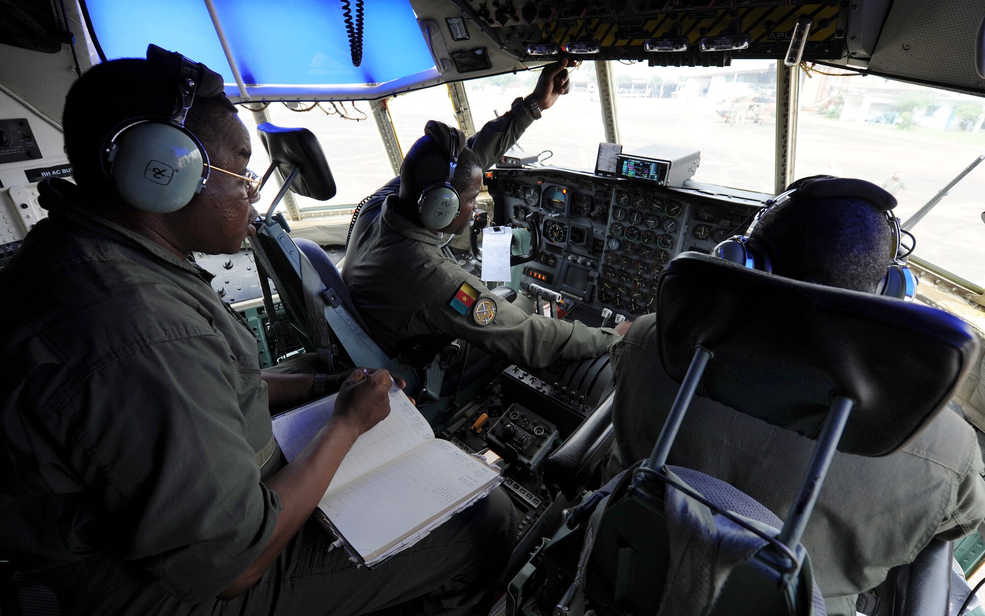 DOUALA, CAMEROON – Cameroon Air Force C-130 air crew members conduct their preflight checks prior to taking off to perform a low-cost low-altitude bundle air drop during Central Accord 2013, at the Douala Air Force Base, Douala, Cameroon, February 28, 2013. Central Accord 2013 is a joint exercise in which U.S., Cameroon and neighboring Central African militaries partner to promote regional cooperation while and increasing aerial resupply and medical readiness capacity. (Photo by Master Sgt. MSgt Stan Parker, 621st CRW Public Affairs)