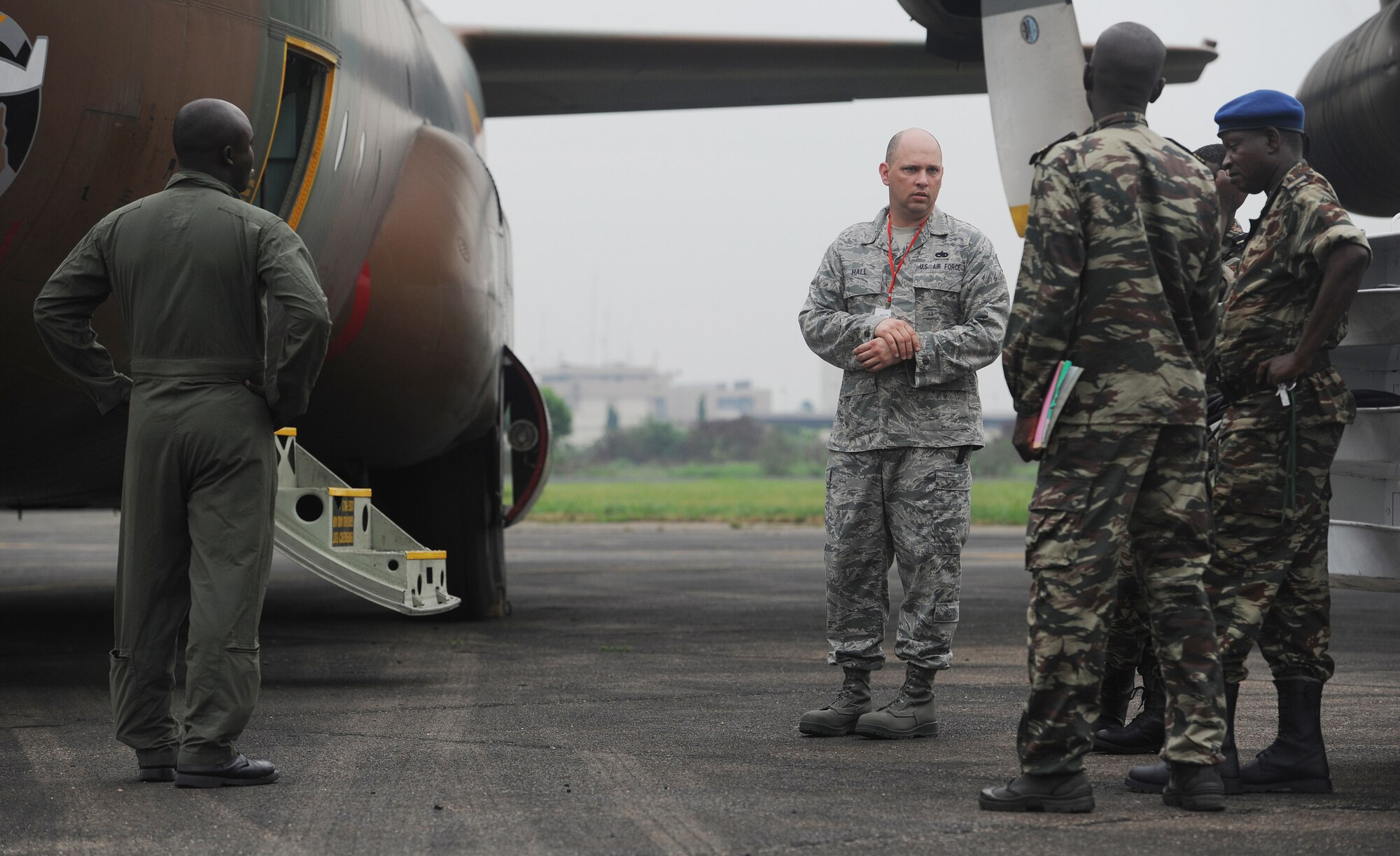 DOUALA, CAMEROON – U.S. Air Force Technical Sgt. Johnny Hall, an aircraft maintenance air advisor assigned to the 818th Mobility Support Advisory Squadron, Joint Base McGuire-Dix-Lakehurst, N.J., shares his aircraft pre-flight inspection experience with Cameroon Air Force maintenance personnel during Central Accord 2013, at Douala Air Force Base, Douala, Cameroon, February 23, 2013. Hall of Lockhart, FL, is participating in Central Accord 2013, a joint exercise in which U.S., Cameroon and neighboring Central African militaries partner to promote regional cooperation while and increasing aerial resupply and medical readiness capacity. (Photo by Master Sgt. MSgt Stan Parker, 621st CRW Public Affairs)