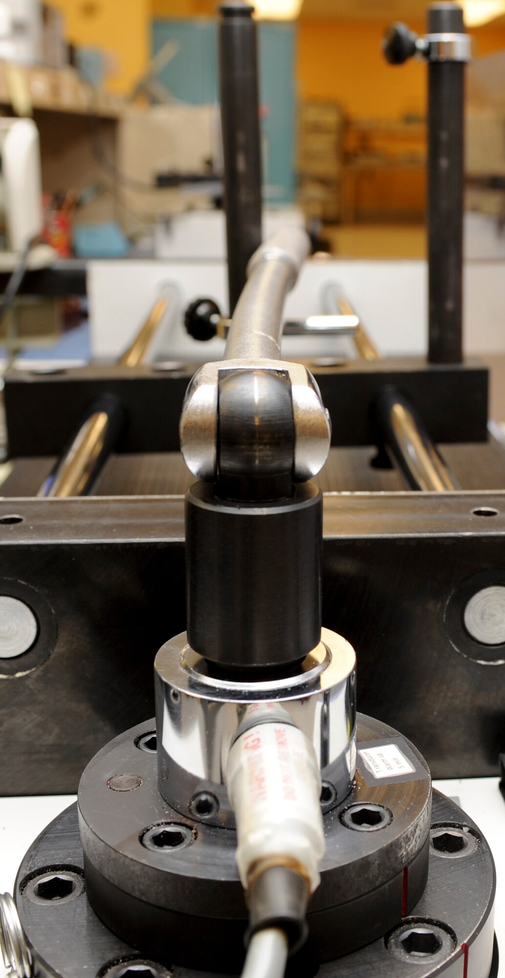 A torque wrench is calibrated using a multitest torque, force and angle testing machine at the precision measurement equipment lab on Ellsworth Air Force Base, S.D., Feb. 20, 2013. All threaded fasteners, such as bolts and nuts have torque ratings as designed by the manufacturer, and can prematurely weaken or break if they are incorrectly tightened. (U.S. Air Force photo by Airman 1st Class Anania Tekurio/Released)