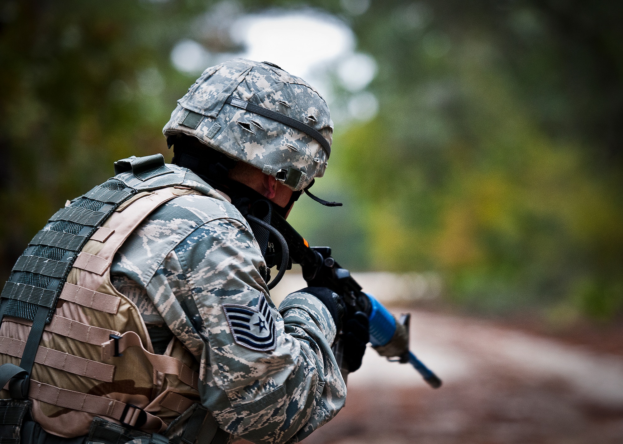 Tech. Sgt. Paul Ruhbusch, of the 96th Security Forces Squadron, scans the area during a targeting acquisition scenario at Eglin Air Force Base, Fla.  The exercise, along with an improvised explosive device detection scenario tested Airmen’s new abilities after participating in a six-week vision training experiment called Battlevision.  The Airmen who took the training scored higher on both scenarios than the control group who had not.  (U.S. Air Force photo/Samuel King Jr.)