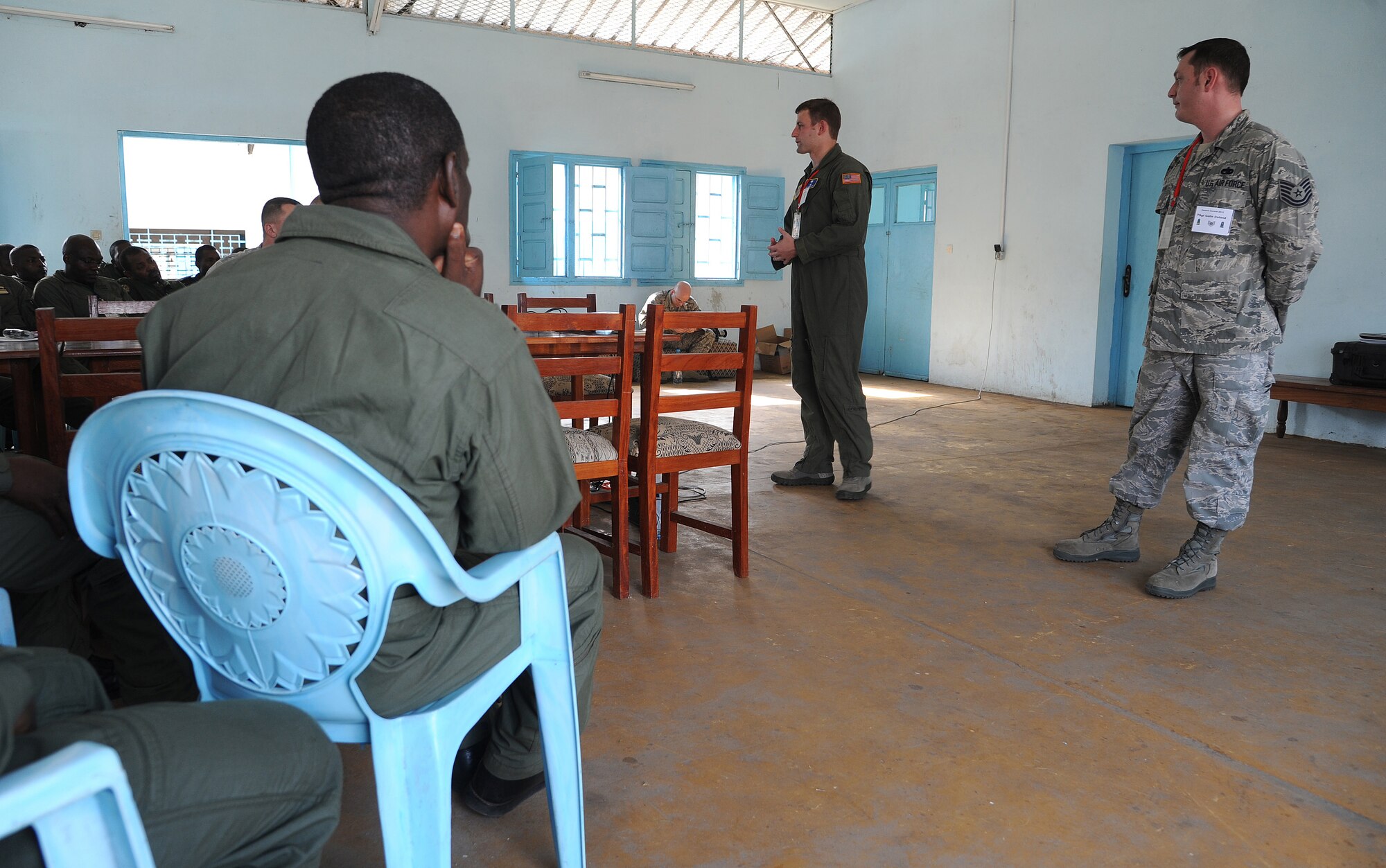 DOUALA, CAMEROON –  U.S. Air Force Staff Sgt. Bryan Smith,  an aircrew rescue air advisor, assigned to the 818th Mobility Support Advisory Squadron, Joint Base McGuire-Dix-Lakehurst, N.J.,  discusses air crew rescue operations with Cameroon Air Force members following the opening ceremony for Central Accord 13, at Douala Air Force Base, Douala, Cameroon, February 20, 2012. Smith is participating in Central Accord 2013, a joint exercise in which U.S., Cameroon and neighboring Central African militaries partner to promote regional cooperation while and increasing aerial resupply and medical readiness capacity. (Photo by Master Sgt. MSgt Stan Parker, 621st CRW Public Affairs)