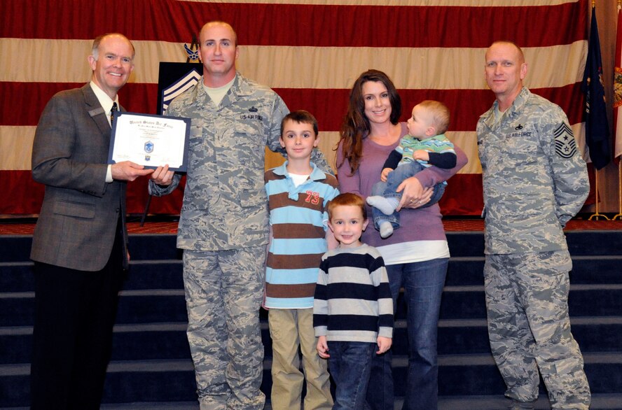 Senior Master Sgt. Jason Motte, Air Force Global Strike Command, receives a certificate of promotion to Master Sgt. from Jeffrey Beene, AFGSC Director of Staff, during the March Wing Promotion Ceremony on Barksdale Air Force Base, La., March 1. (U.S. Air Force photo/Airman 1st Class Andrew Moua)