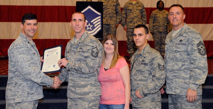 Master Sgt. Christopher Scott, 2nd Operations Squadron, receives a certificate of promotion to Master Sgt. from Col. Andrew Gebara, 2nd Bomb Wing commander, during the March Wing Promotion Ceremony on Barksdale Air Force Base, La., March 1. (U.S. Air Force photo/Airman 1st Class Andrew Moua)