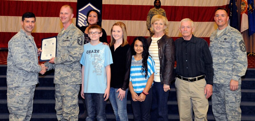 Master Sgt. Bryan Early, 2nd Civil Engineer Squadron, receives a certificate of promotion to Master Sgt. from Col. Andrew Gebara, 2nd Bomb Wing commander, during the March Wing Promotion Ceremony on Barksdale Air Force Base, La., March 1. (U.S. Air Force photo/Airman 1st Class Andrew Moua)