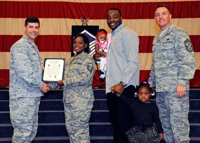 Master Sgt. Erica Marshall, 2nd Aerospace Medical Squadron, receives a certificate of promotion to Master Sgt. from Col. Andrew Gebara, 2nd Bomb Wing commander, during the March Wing Promotion Ceremony on Barksdale Air Force Base, La., March 1. (U.S. Air Force photo/Airman 1st Class Andrew Moua)