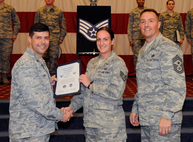 Staff Sgt. Nicole Depew, 2nd Operations Squadron, receives a certificate of promotion to Staff Sgt. from Col. Andrew Gebara, 2nd Bomb Wing commander, during the March Wing Promotion Ceremony on Barksdale Air Force Base, La., March 1. (U.S. Air Force photo/Airman 1st Class Andrew Moua)