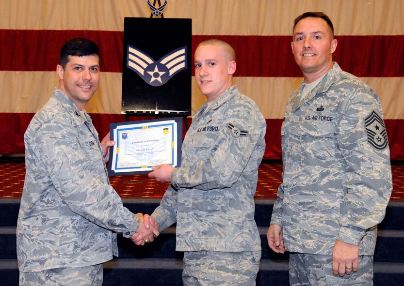 Airman 1st Class Weyman Evans, 2nd Aircraft Maintenance Squadron, receives a certificate of promotion to Senior Airman from Col. Andrew Gebara, 2nd Bomb Wing commander, during the March Wing Promotion Ceremony on Barksdale Air Force Base, La., March 1. (U.S. Air Force photo/Airman 1st Class Andrew Moua)