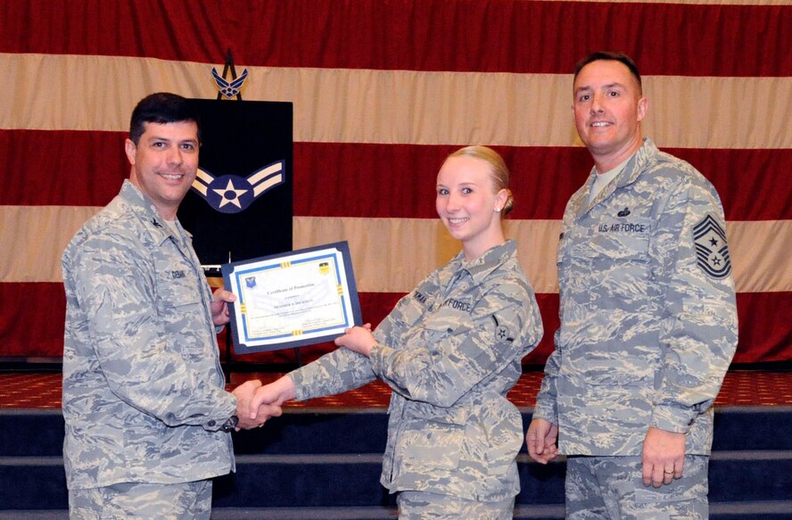 Airman Heather Hickman, 2nd Aerospace Medical Squadron, receives a certificate of promotion to Airman 1st Class from Col. Andrew Gebara, 2nd Bomb Wing commander, during the March Wing Promotion Ceremony on Barksdale Air Force Base, La., March 1. (U.S. Air Force photo/Airman 1st Class Andrew Moua)
