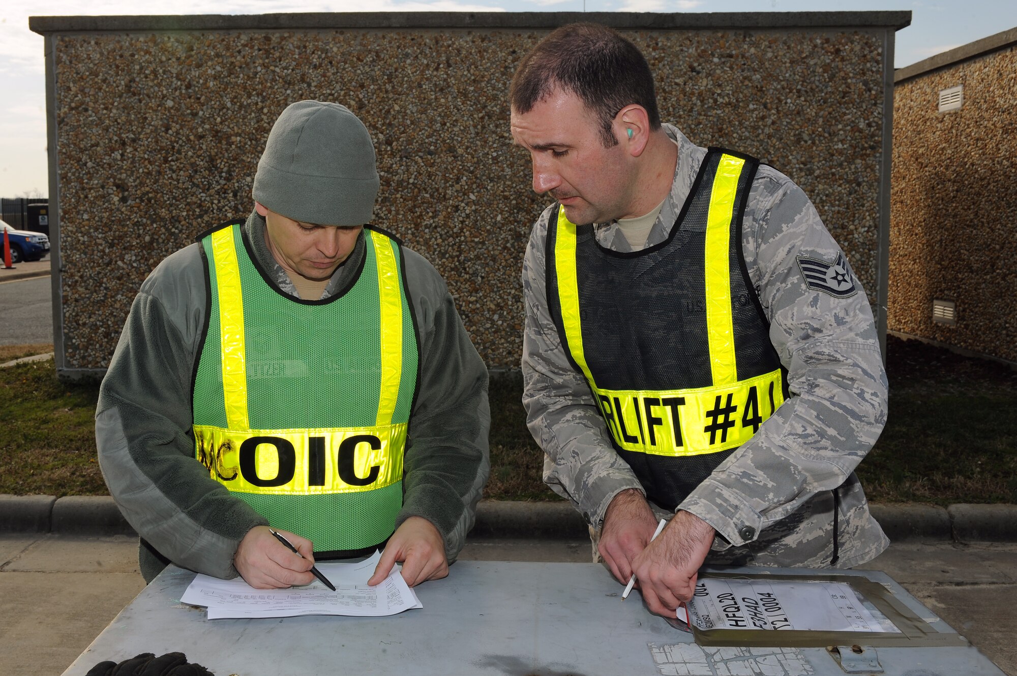 U.S. Air Force Master Sgt. Paul Altizer (left), 4th Logistics Readiness Squadron cargo deployment function NCO in charge, and Staff Sgt. Justin Smilo, 4th LRS joint inspector, checks cargo deployment increments during Operational Readiness Inspection CORONET WHITE on Seymour Johnson Air Force Base, N.C., Mar. 5, 2013. The inspection tests Airmen in pre-deployment processes, emergency situations and the ability to survive and operate in a deployed environment. (U.S. Air Force photo/Airman 1st Class John Nieves Camacho/Released)