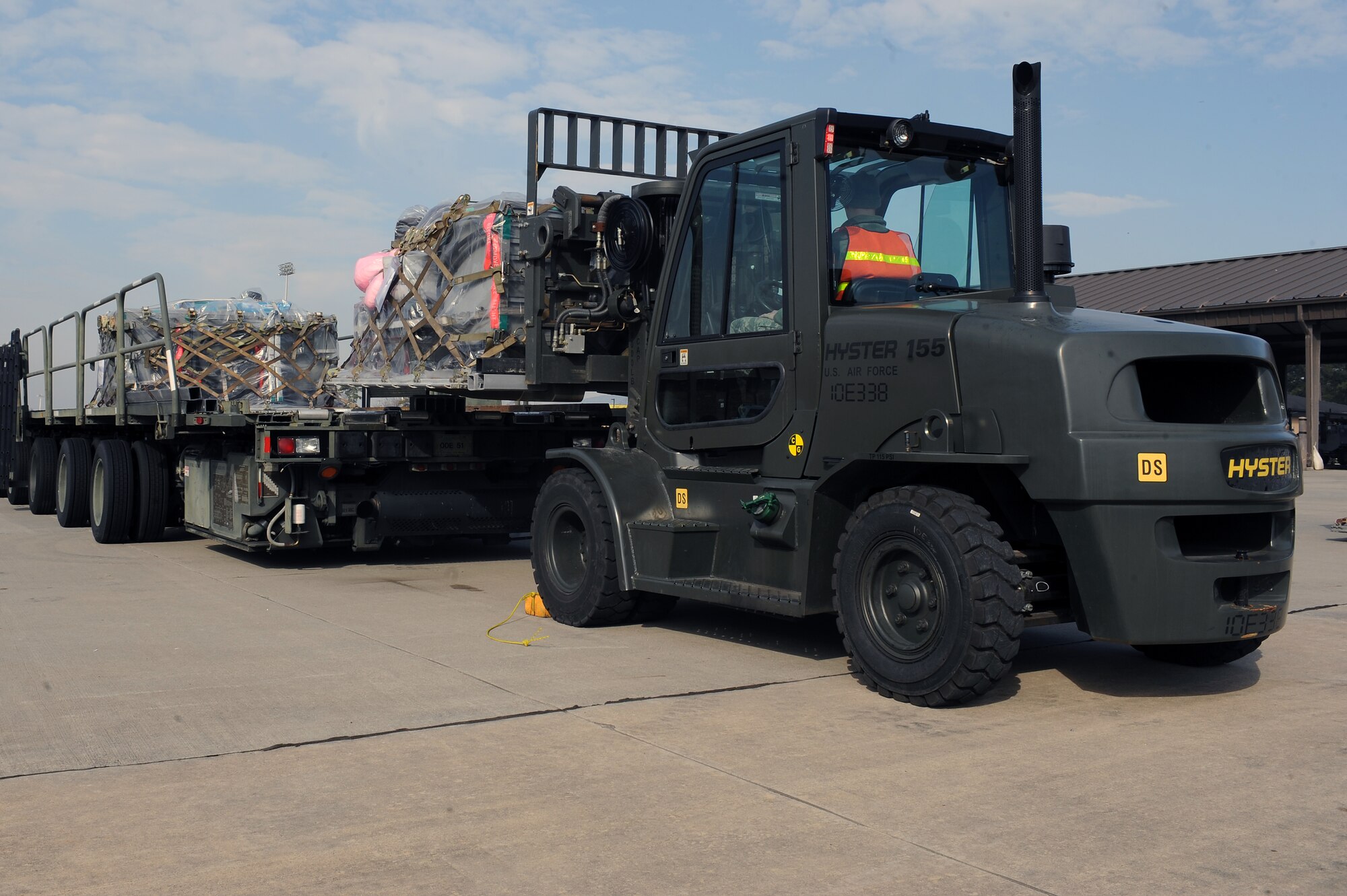 Cargo is loaded onto a trailer bed by 4th Logistics Readiness Squadron Airmen during Operational Readiness Inspection CORONET WHITE on Seymour Johnson Air Force Base, N.C., Mar. 5, 2013. The inspection tests Airmen in pre-deployment processes, emergency situations and the ability to survive and operate in a deployed environment. (U.S. Air Force photo/Airman 1st Class John Nieves Camacho/Released)