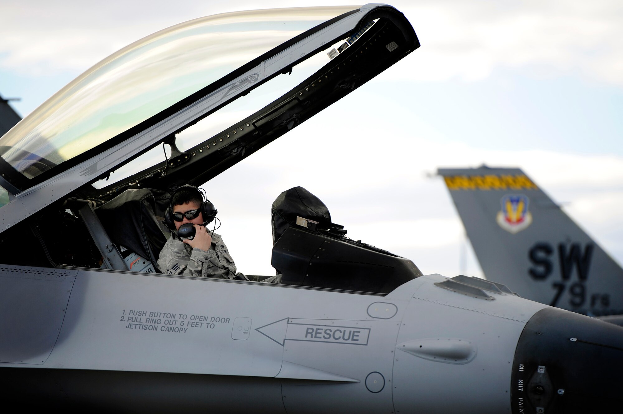 An aircraft maintainer assigned to the 20th Aircraft Maintenance Squadron works with other Airmen to prep a 79th Fighter Squadron F-16 Fighting Falcon for takeoff during Red Flag 13-3, Feb. 23, 2013, Nellis Air Force Base, Nev. The 79th FS has 15 F-16 Fighting Falcons on the ground at Nellis AFB and 35 pilots slated to fly throughout the Red Flag exercise. (U.S. Air Force photo by Staff Sgt. Kenny Holston/Released)
