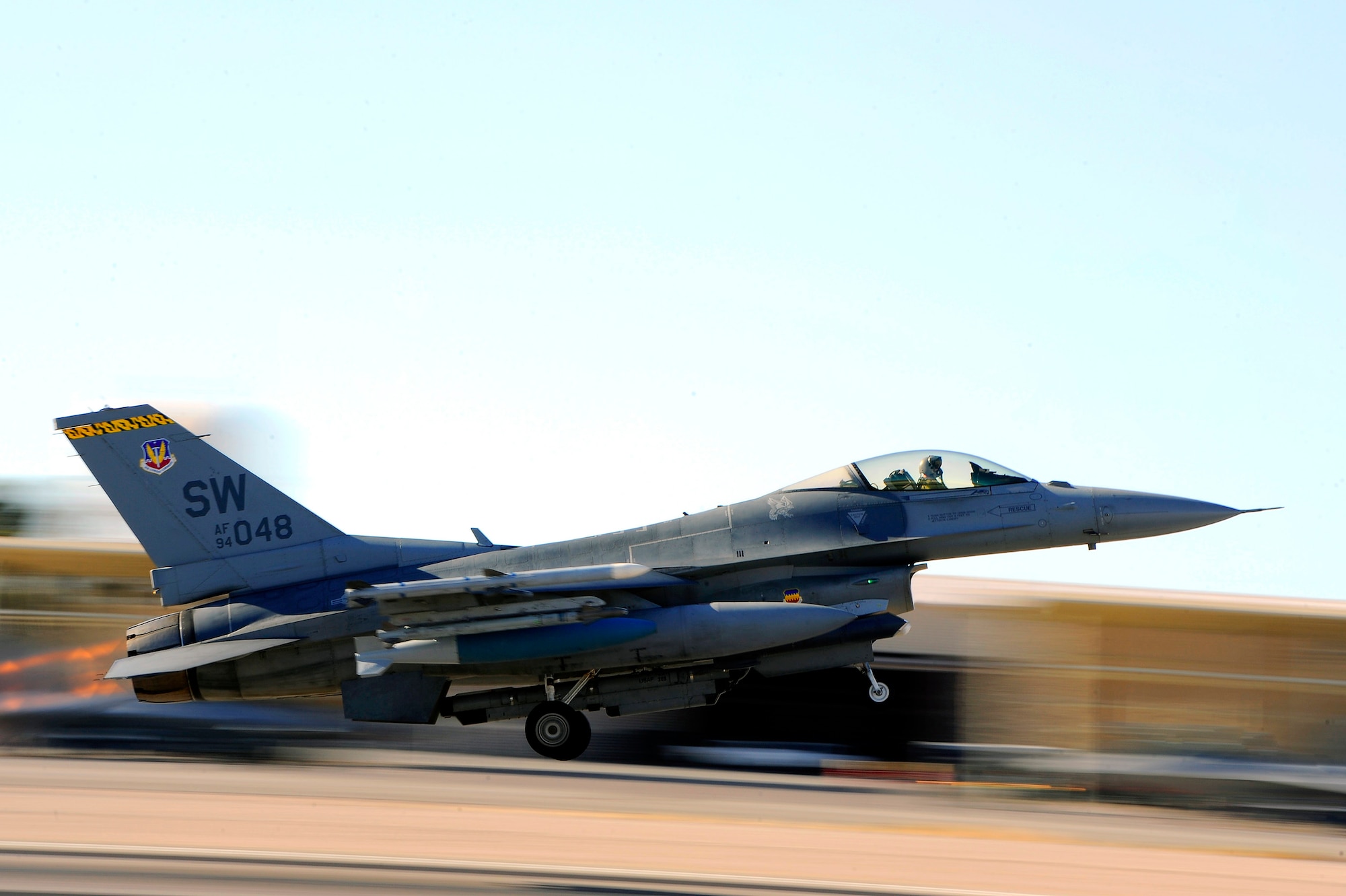 A 79th Fighter Squadron ‘Tigers’ F-16 Fighting Falcon races down the Nellis Air Force Base, Nev., runway as it takes off for a mission during Red Flag 13-3, Feb. 27, 2013. The ‘Tigers’ launched a total of 16 times during day and night time missions to kick off the exercise. The unit has approximately 15 F-16 Fighting Falcons on the ground at Nellis AFB and 35 pilots slated to fly throughout the three-week long exercise. (U.S. Air Force photo by Staff Sgt. Kenny Holston/Released)