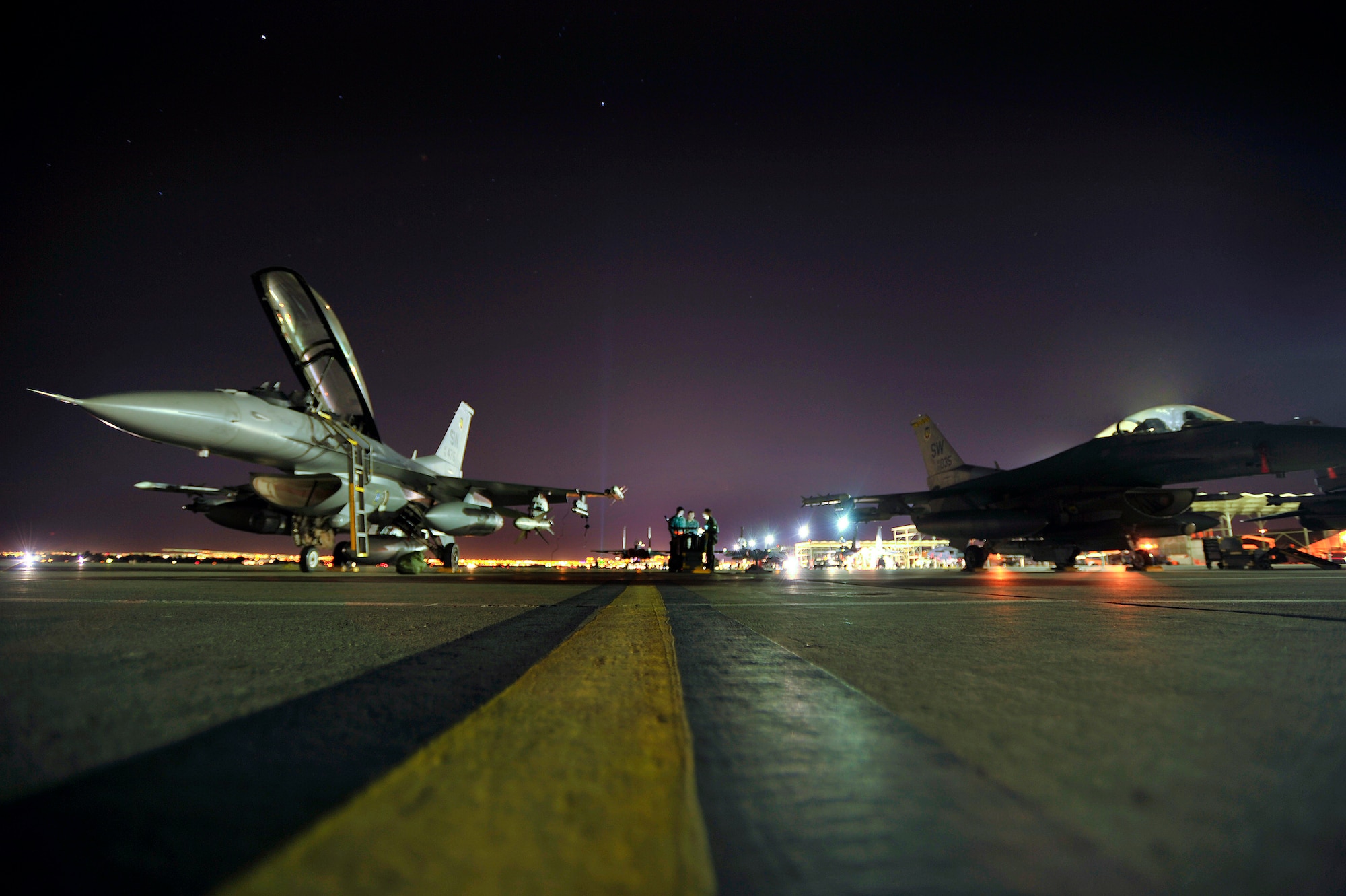 U.S. Air Force maintainers and crew chiefs assigned to the 20th Aircraft Maintenance Squadron prep F-16 Fighting Falcons assigned to the 79th Fighter Squadron ‘Tigers,’ prior to launching them for a night mission during Red Flag 13-3, Feb. 27, 2013, Nellis Air Force Base, Nev. Maintainers and crew chiefs have worked around-the-clock since the start of Red Flag to ensure 79th FS aircraft are ready to fly. (U.S. Air Force photo by Staff Sgt. Kenny Holston/Released)