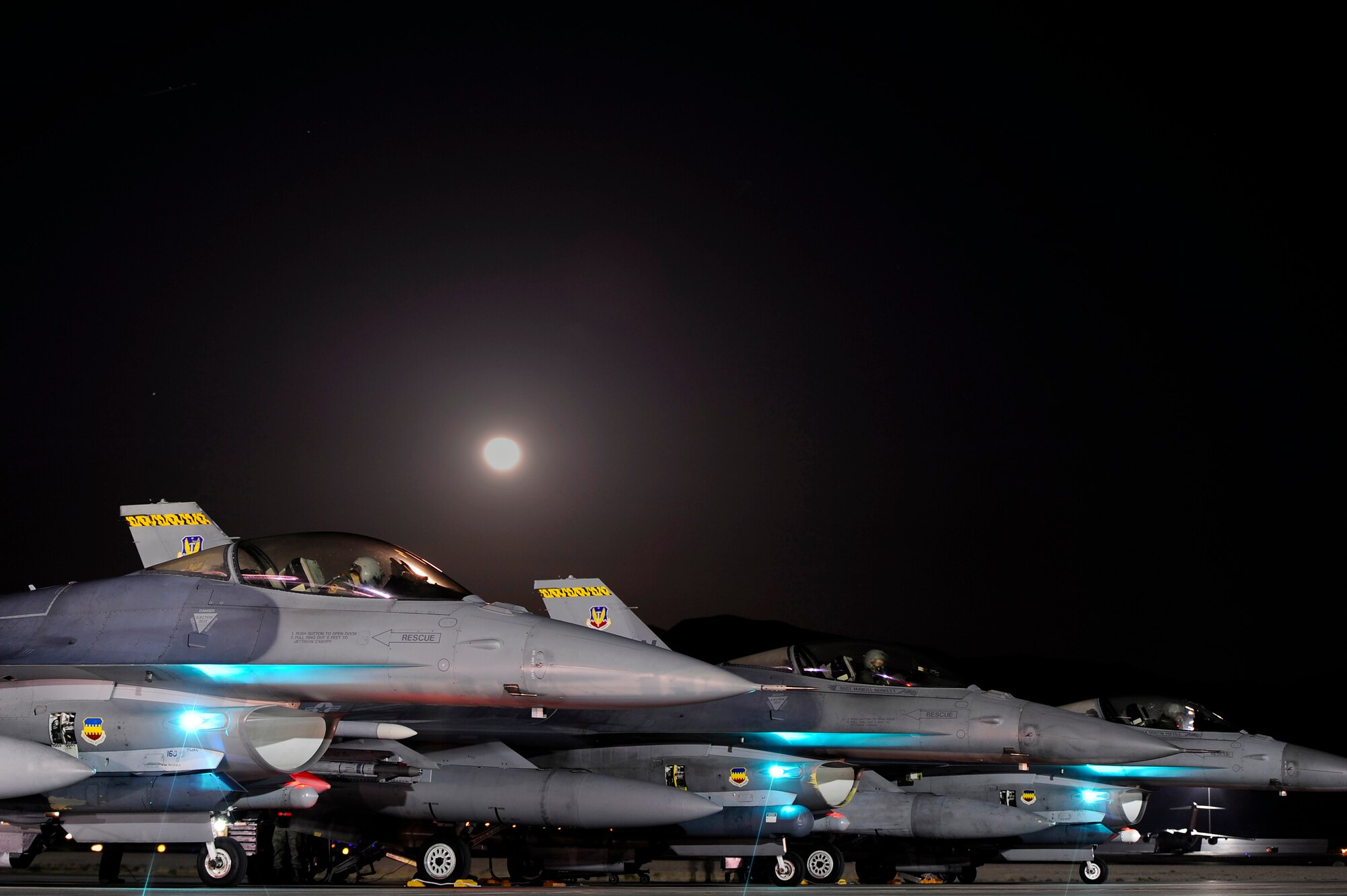 U.S. Air Force pilots assigned to the 79th Fighter Squadron ‘Tigers’ get situated in the cockpits of their F-16 Fighting Falcons prior to takeoff during Red Flag 13-3, Feb. 27, 2013, Nellis Air Force Base, Nev. Members assigned to the 79th FS have flown around-the-clock to gain as much combat training as possible during the three-week long exercise. (U.S. Air Force photo by Staff Sgt. Kenny Holston/Released)