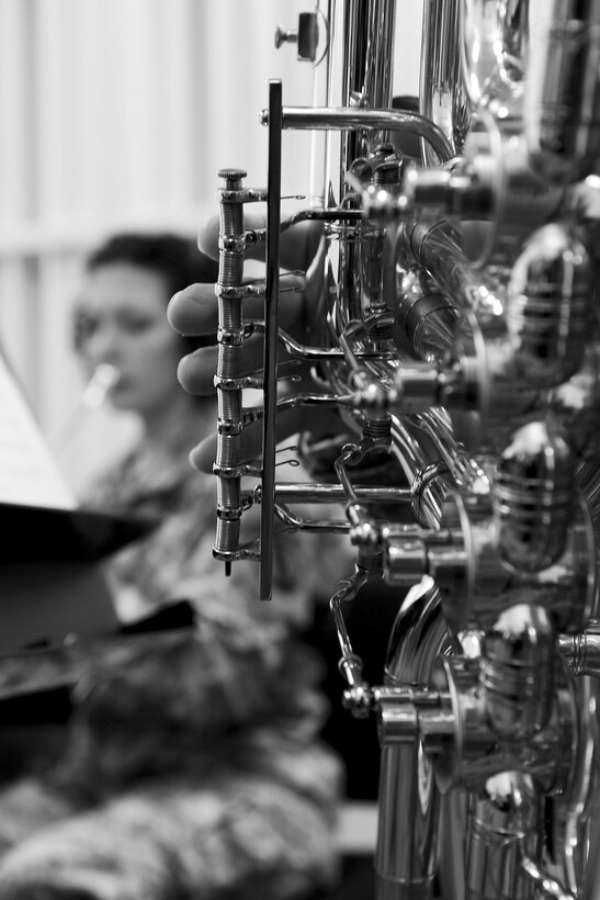 U.S. Army Spc. Anna Leverenz, Training and Doctrine Command band French horn player, (left), performs a song while TRADOC tuba player, Sgt. 1st. Class Tony Reost, plays along during practice at Fort Eustis, Va., Feb. 27, 2013. The band performs concerts in various local communities and states, touring nationwide in support of the TRADOC mission. (U.S. Air Force photo by Staff Sgt. Ashley Hawkins/Released) 