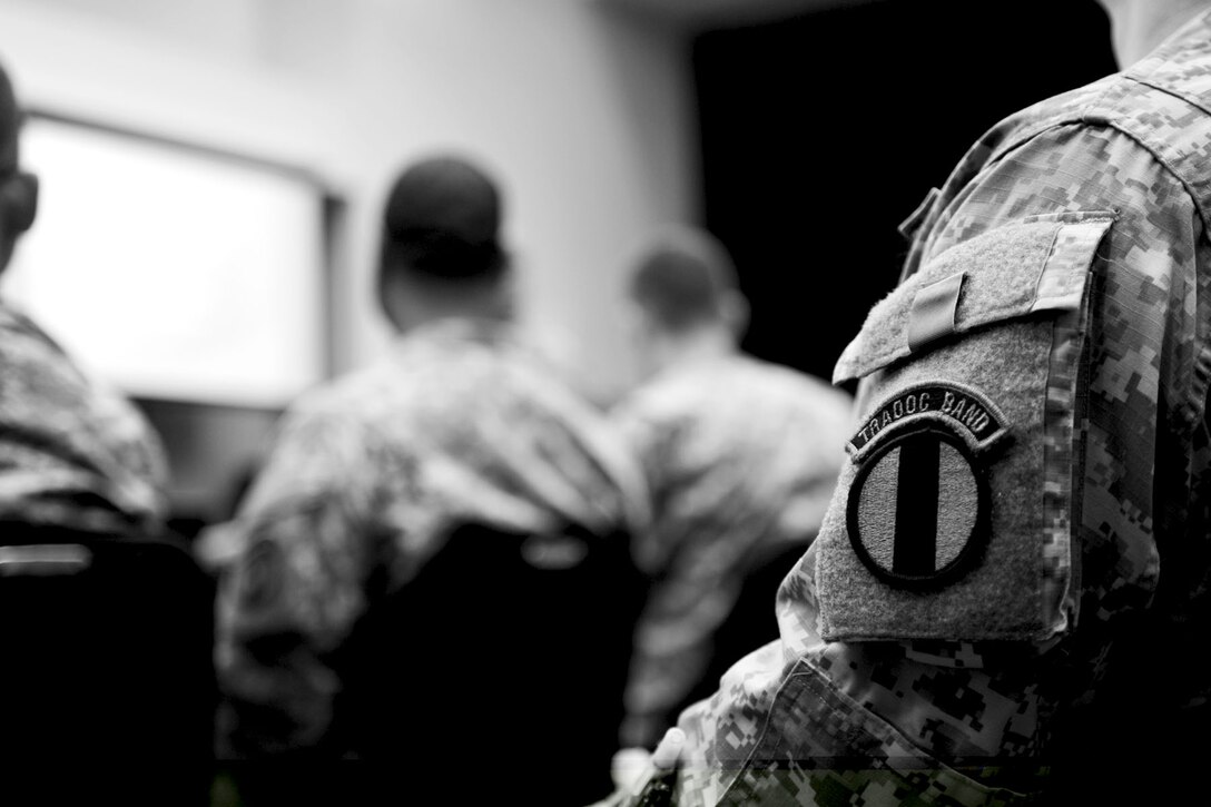 Members assigned to the U.S. Army Training and Doctrine Command band attend training at Fort Eustis, Va., Feb. 27, 2013. After morning formation, the unit gathers together to attend daily training to stay up-to-date on Army regulations and responsibilities. (U.S. Air Force photo by Staff Sgt. Ashley Hawkins/Released) 