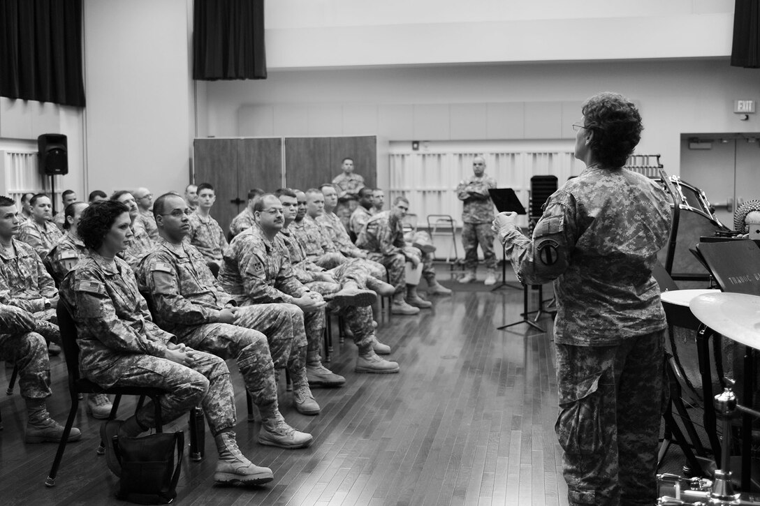 U.S. Army Command Sgt. Maj. Wendy Thompson, (right), Army Training and Doctrine Command band, addresses the unit before training at Fort Eustis, Va., Feb. 27, 2013. As part of their daily duties, the unit attends training as a whole to make sure everyone is up to date. (U.S. Air Force photo by Staff Sgt. Ashley Hawkins/Released) 