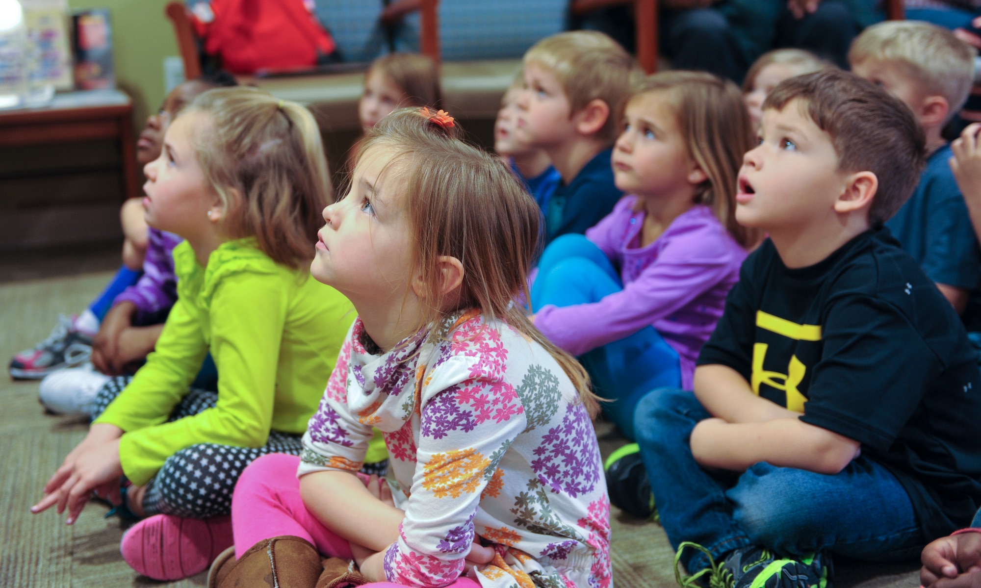 Children from the Child Development Center watch an educational video on how to properly brush and floss their teeth at Moody Air Force Base Ga., Feb. 13, 2013. February is Children’s Dental Health Month, so the dental clinic is educating children on proper dental hygiene. (U.S. Air Force photo by Airman Alexis Grotz/Released)