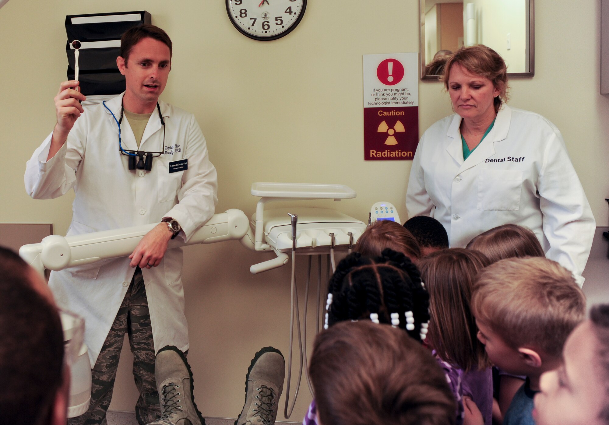 U.S. Air Force Capt. (Dr.) Sean McCauley, 23rd Aeromedical Dental Squadron dentist, shows the different tools used to clean teeth at the dental clinic at Moody Air Force Base Ga., Feb. 13, 2013. Children from the Child Development Center came to learn the importance of keeping their teeth clean and healthy. (U.S. Air Force photo by Airman Alexis Grotz/Released)