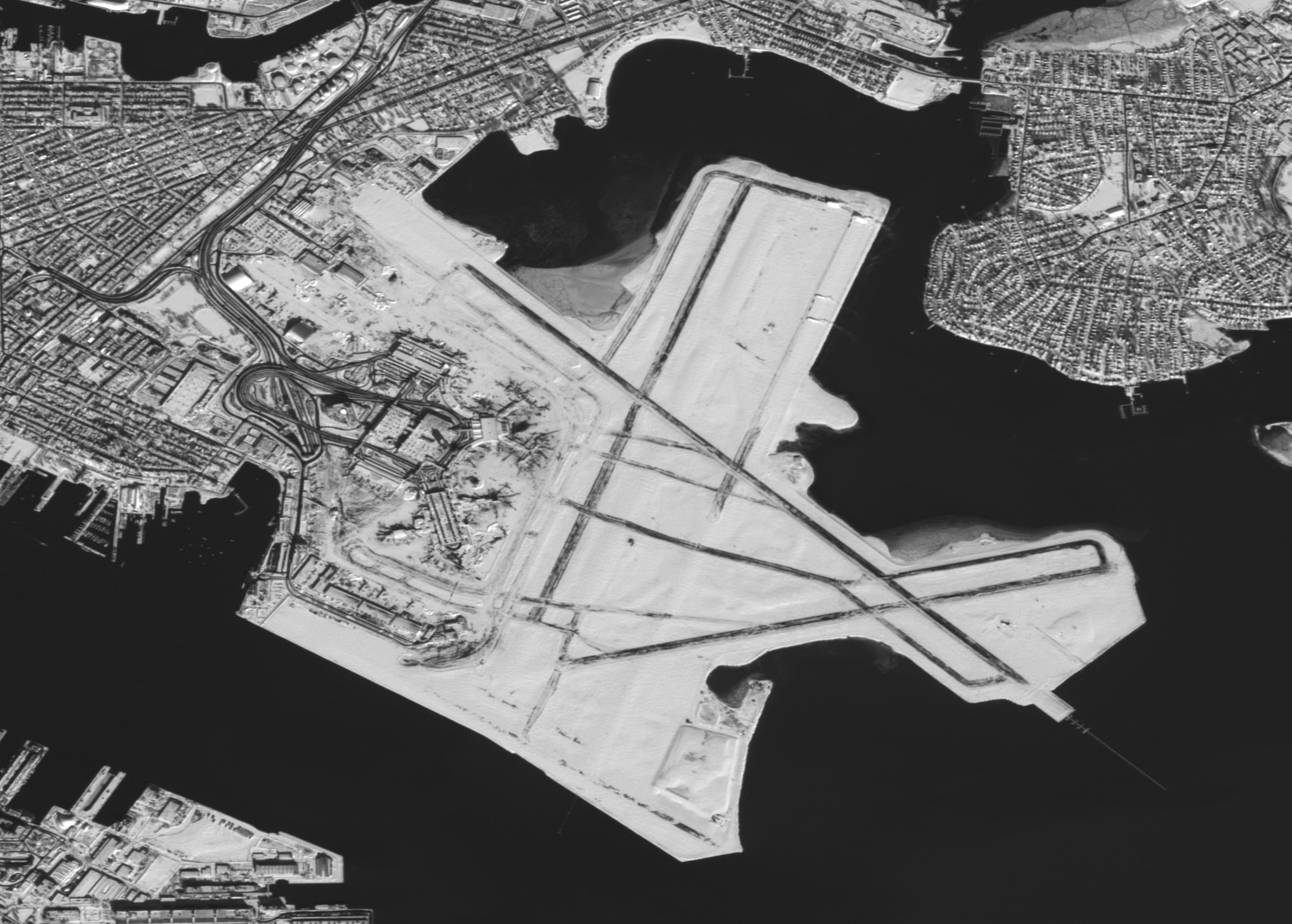 A 2.5 meter image of the Boston Logan International Airport (BOS) taken from the SPOT-5 satellite on February 10, 2013.  BOS averages over 900 flights per day and was forced to cancel flights after receiving up to 24.9 inches of snow. The airport gradually resumed normal operations by February 11, 2013.
(National Guard satellite image courtesy 169th Communications Flight, Eagle Vision IV/RELEASED)
