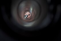 U.S. Air Force Airman 1st Class Christopher Carlson, weapons load crew journeyman of the 1st Special Operations Equipment Maintenance Squadron, inspects the barrel of a 105 millimeter cannon on an AC-130U Spectre at Hurlburt Field, Fla., Feb. 27, 2013. Inspections are completed before and after each flight to ensure that all equipment is safe operation. (U.S. Air Force photo by Senior Airman Krystal M. Garrett)
