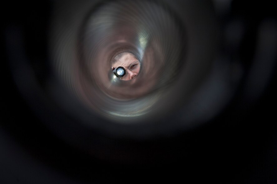U.S. Air Force Airman 1st Class Christopher Carlson, weapons load crew journeyman of the 1st Special Operations Equipment Maintenance Squadron, inspects the barrel of a 105 millimeter cannon on an AC-130U Spectre at Hurlburt Field, Fla., Feb. 27, 2013. Inspections are completed before and after each flight to ensure that all equipment is safe operation. (U.S. Air Force photo by Senior Airman Krystal M. Garrett)