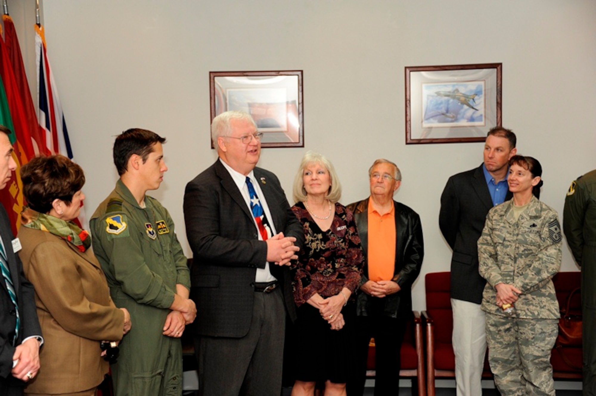 Col. (Ret) Dennis Marquardt (3rd from left) and his wife Peg (4th from left) address the audience during the Euro-NATO Jet Pilot Training Program Hall of Fame ceremony at the 80th Flying Training Wing headquarters building at Sheppard Air Force Base, Texas on March 5, 2013.  The Marquardt's are the 18th inductees into the ENJPPT Hall of Fame. (U.S. Air Force photo/Danny Webb)