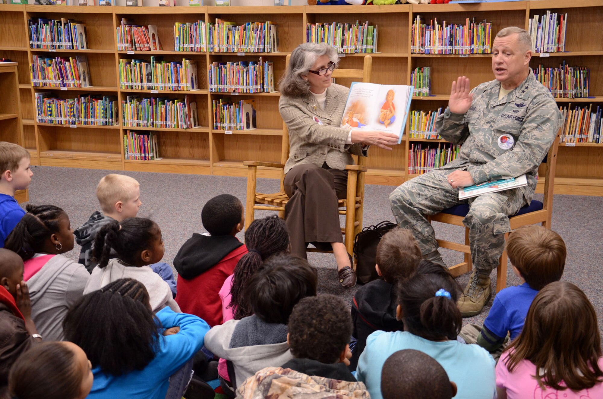 Maj. Gen. Lawrence Wells, and his wife Kathy Wells read “Muddypaws,” by Moria Butterfield, to a group of second graders March 1 at Shaw Heights Elementary School in honor of Read Across America Day. General Wells, 9th Air Force commander, Shaw Air Force Base, S.C., and Mrs. Wells enjoy periodically reading to school children throughout the year. (U.S. Air Force Photo by Staff Sgt. Amanda Currier)