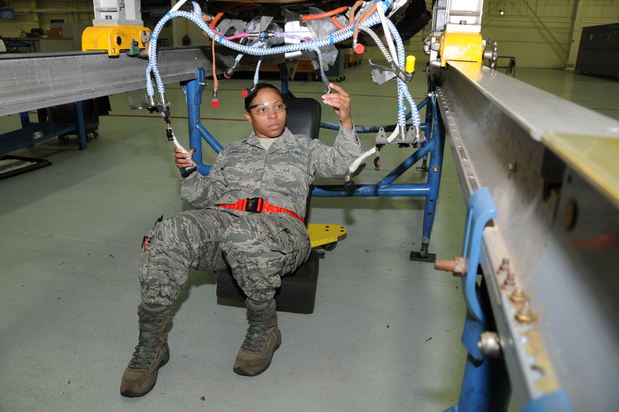Tech. Sgt. Rachel Chambers, 192nd Fighter Wing Jet Engine Intermediate Maintenance jet propulsion technician, carefully inspects an F-22 engine connector cables Feb. 10, 2013 in preparation for a Logistics Compliance Assessment Program evaluation.  The LCAP provides leadership with an assessment of the unit's ability to perform key logistics processes in a safe, standardized, repeatable and technically compliant manner.  (U.S. Air Force photo by Master Sgt. Carlos J. Claudio/Released)