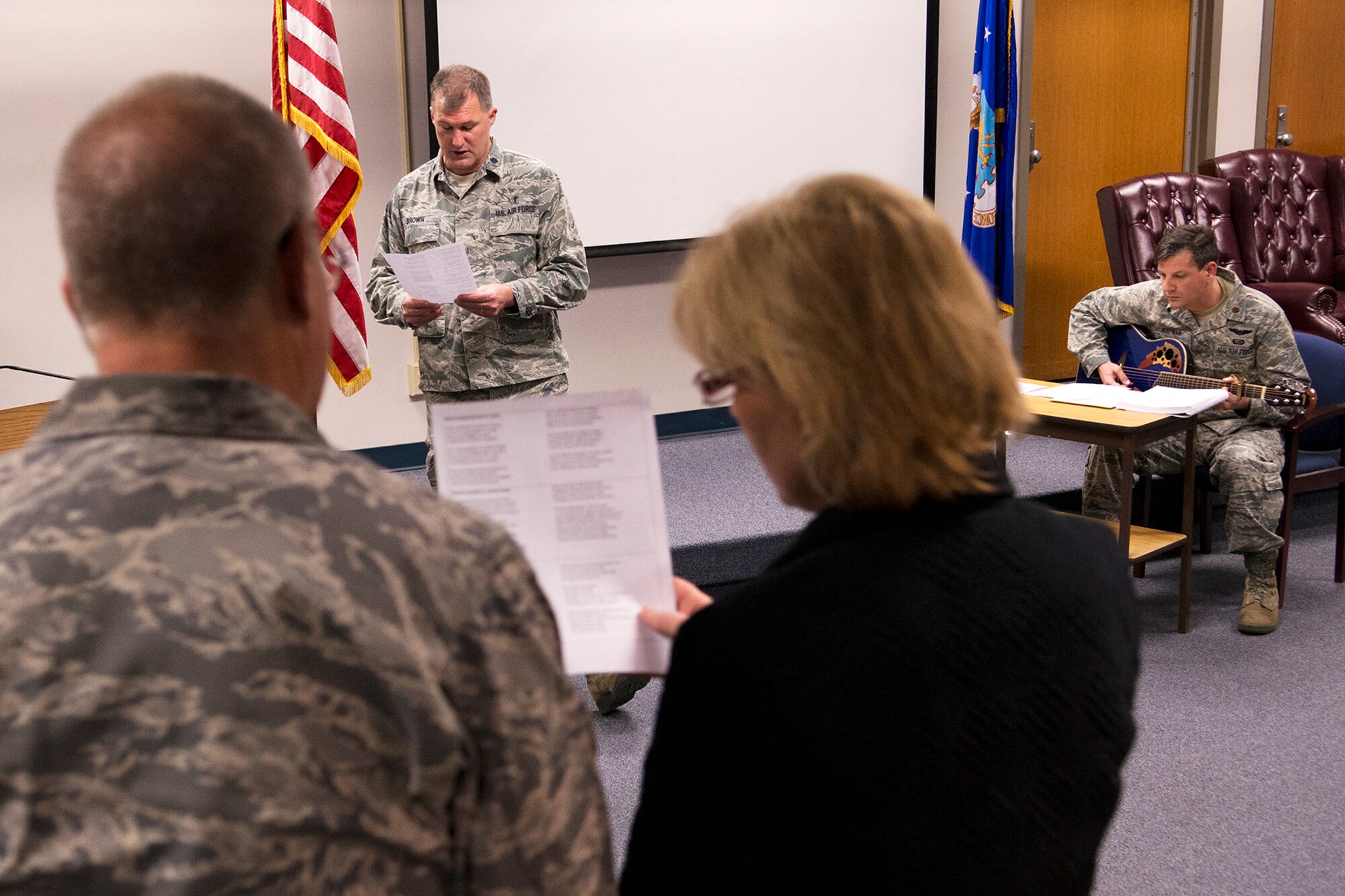 U.S. Air Force Lt. Col. Kenneth Brown, 307th Bomb Wing Chaplain, leads in the singing of "Amazing Grace" during a morning worship service, Mar. 3, 2013, Barksdale Air Force Base, La. Every month, a service is held during the main Unit Training Assembly from 1030 to 1100 in the 307th BW auditorium, and all are welcome to attend. (U.S. Air Force photo by Master Sgt. Greg Steele/Released)