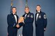 Master Sgt. Mike G. Mascorro, Personnel Support for Contingency Operations Training chief Det. 1, 823rd REDHORSE, accepts the Senior NCO of the Year award at the Annual Awards Banquet Feb. 20 from Col. David E. Graff, 325th Fighter Wing commander, and Chief Master Sgt. Ray DeVite, 325th FW command chief. (U.S. Air Force photo by Lisa Norman)
