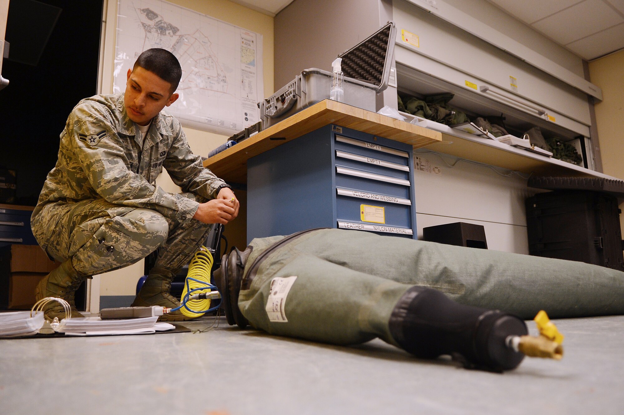 U.S. Air Force Airman 1st Class Jacob Mendoza, 55th Aircraft Maintenance Unit aircrew flight equipment technician tests an immersion dry suit at Shaw Air Force Base S.C., Feb. 27, 2013.  Aircrew flight equipment technicians are responsible for ensuring the safety of pilots through the maintenance of helmets, oxygen masks and other flight gear.  (U.S. Air Force photo by Airman 1st Class Nicole Sikorski/Released)
