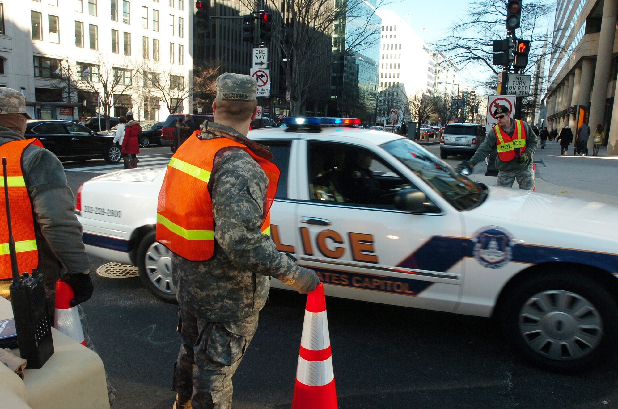 Staff Sgt. Justin A Connor (right), 192nd Fighter Wing, Security Forces Squadron, operates traffic control points in support of the 57th Presidential Inauguration Jan. 21, 2013 in Washington, D.C.  More than 600 Virginia National Guard Soldiers and Airmen joined a force of approximately 6,000 National Guard personnel from 25 states and territories supporting the inauguration with traffic control, crowd management, communications and chaplain support.  (Photo by Sgt. 1st Class A.J. Coyne, Virginia Guard Public Affairs)