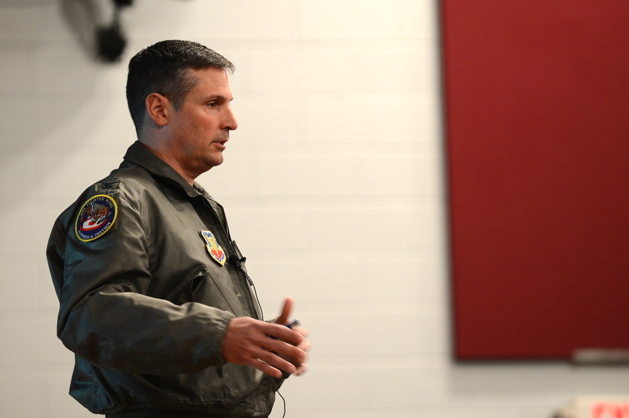U.S. Air Force Col. Clay Hall, 20th Fighter Wing commander, speaks to Airmen and civilians at Shaw during a town hall style meeting at Shaw Air Force Base, S.C., Feb., 28, 2013.  During the meeting, Hall spoke about local impacts of sequestration, military contracting at Shaw, renovations in the single Airmen dorms and other up and coming projects for modernization at Shaw. (U.S. Air Force photo by Airman 1st Class Nicole Sikorski/Released)