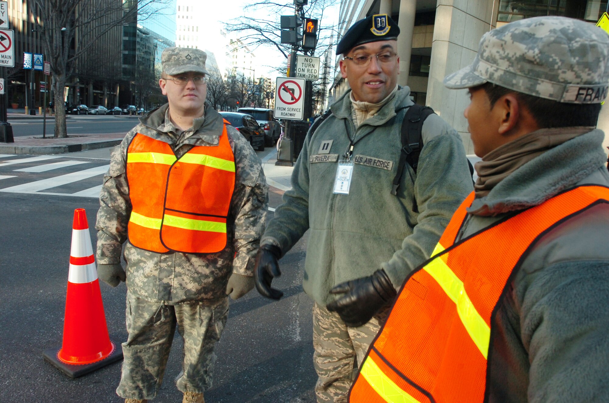 Captain Luis R. Rivera (middle), 192nd Fighter Wing, Security Forces Squadron, operates traffic control points in support of the 57th Presidential Inauguration Jan. 21, 2013 in Washington, D.C.  More than 600 Virginia National Guard Soldiers and Airmen joined a force of approximately 6,000 National Guard personnel from 25 states and territories supporting the inauguration with traffic control, crowd management, communications and chaplain support.  (Photo by Sgt. 1st Class A.J. Coyne, Virginia Guard Public Affairs)
