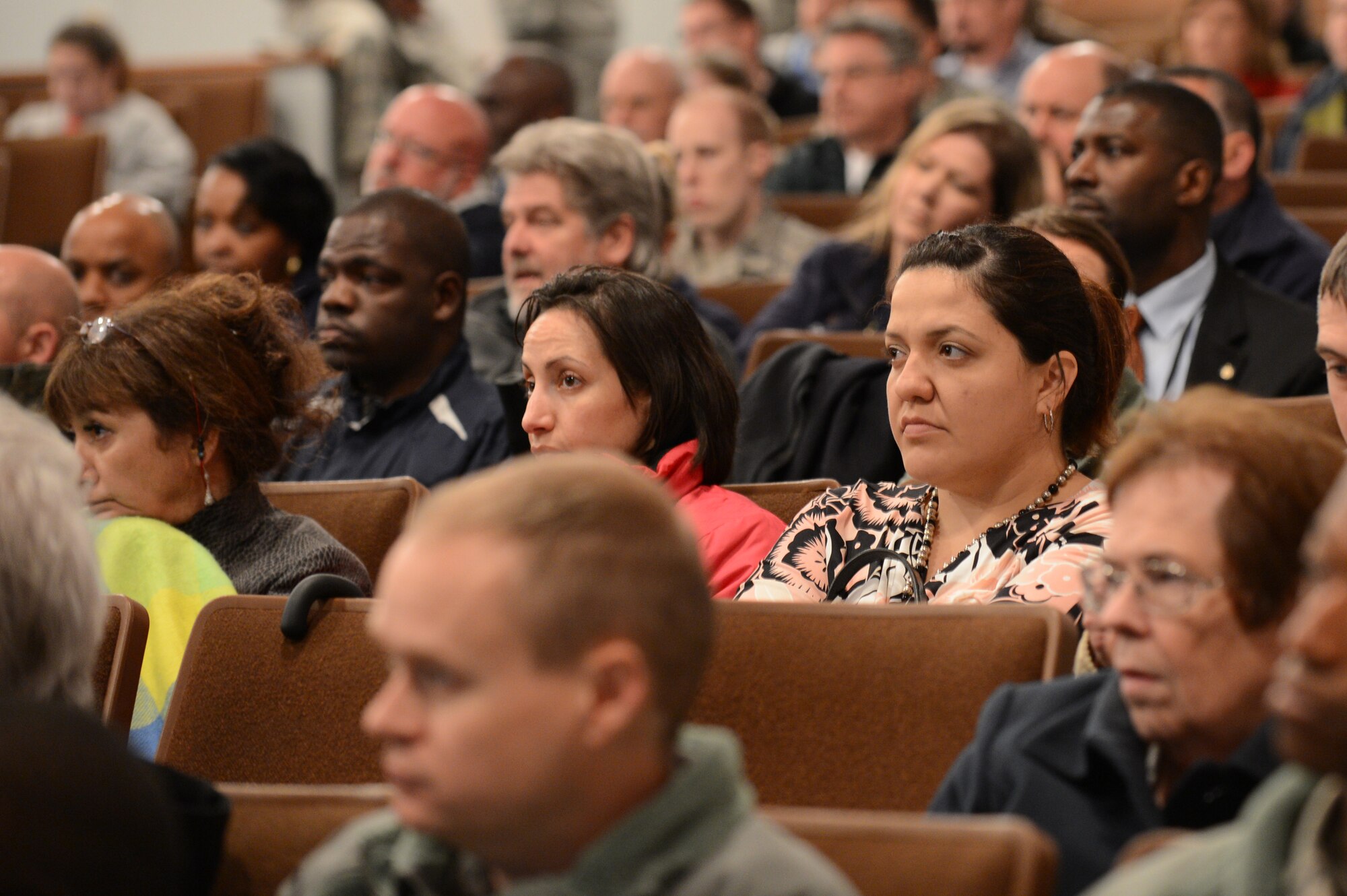 Airmen listen to a presentation from U.S. Air Force Col. Clay Hall, 20th Fighter Wing commander, at Shaw during a town hall style meeting at Shaw Air Force Base, S.C., Feb., 28, 2013.  During the meeting, Hall spoke about local impacts of sequestration, military contracting at Shaw, renovations in the single Airmen dorms and other upcoming projects for modernization at Shaw. (U.S. Air Force photo by Airman 1st Class Nicole Sikorski/Released)