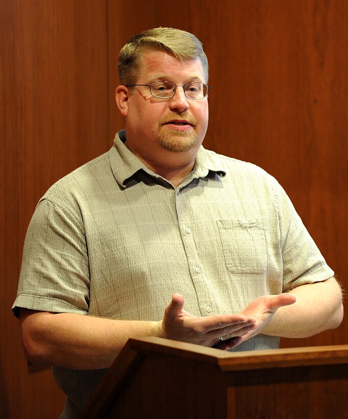 David Brinkworth, Airman and Family Readiness Center Community Readiness consultant, teaches Airmen, family members and civilians how to protect themselves against identity theft during a financial seminar in the Deployment Center at Ellsworth Air Force Base, S.D., Feb. 28, 2013. The week-long event, known as Military Saves Week, included book readings to children in the Child Development Center and the Holbrook Library, and daily financial seminars in the Deployment Center. (U.S. Air Force photo by Airman 1st Class Hrair H. Palyan/Released)