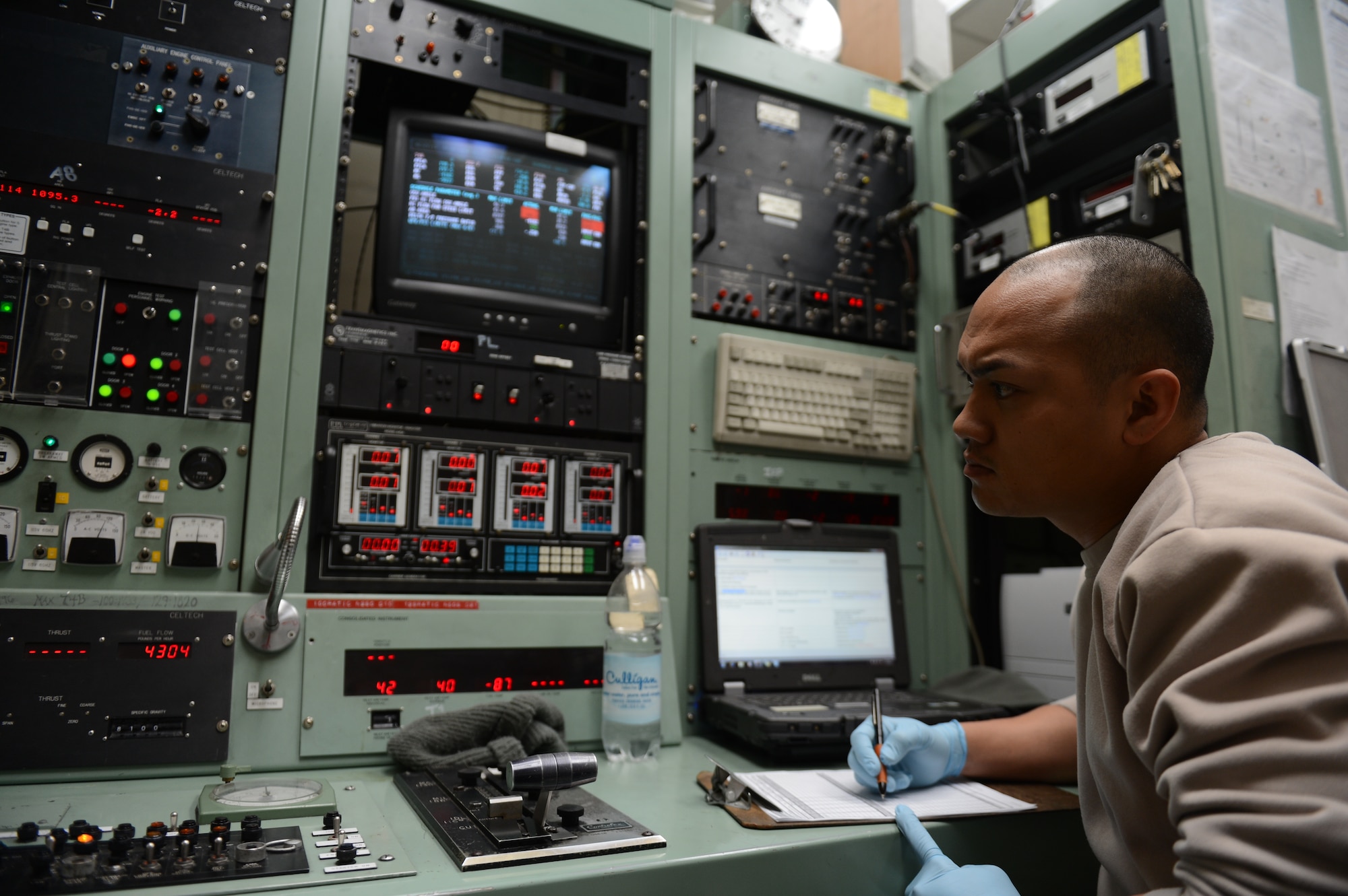 SPANGDAHLEM IAR BASE, Germany – Staff Sgt. Nathandeno Santos, 52nd Component Maintenance Squadron aerospace propulsion technician from Guam, records data in an engine test cell Feb. 27, 2013. After receiving maintenance, engines must pass certain tests before returning to operational aircraft. (U.S. Air Force photo by Airman 1st Class Gustavo Castillo/Released)
