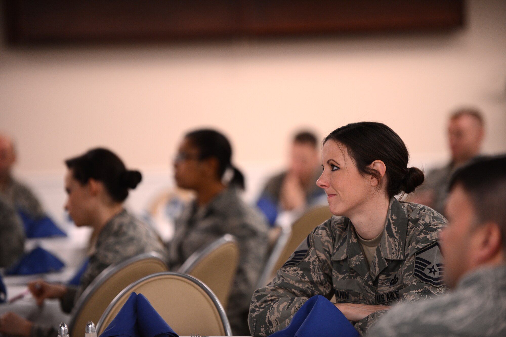 Airmen listen to a presentation at the Carolina Skies Club and Conference Center, Shaw Air Force Base, S.C., Feb., 28, 2013.  The breakfast kicked off the 2013 Air Force Assistance Fund campaign here.  Four major charities, all of which help Airmen, benefit the AFAF: the Air Force Aid Society, Air Force Villages, Air Force Enlisted Villages and the General and Mrs. Curtis E. LeMay Foundation.  (U.S. Air Force photo by Airman 1st Class Nicole Sikorski/Released)