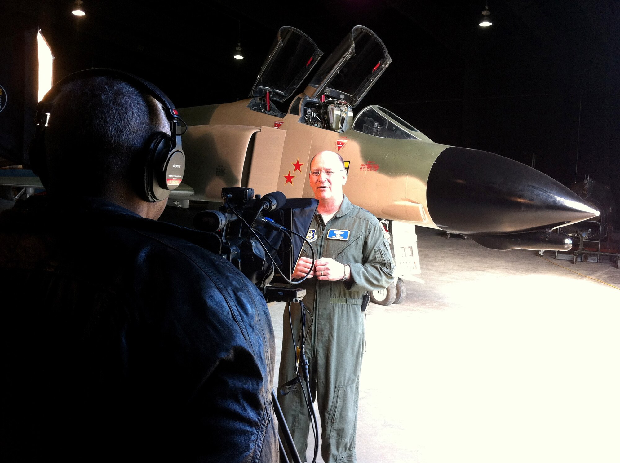 Lt. Gen. James F. Jackson, Air Force Reserve Command commander, records a video introduction for the AFRC Wingman Toolkit website in front of an F-4 Phantom at the Museum of Aviation at Robins Air Force Base, Ga., March 4, 2013. It was in an F-4 that then-Capt. Bob Pardo pushed his wingman to safety during the Vietnam War. Retired Lt. Col. Pardo's story is highlighted on the Wingman Toolkit website. For everything you need to know to be a good wingman, visit the website at www.afrc.wingmantoolkit.org. (U.S. Air Force photo by Bo Joyner)
