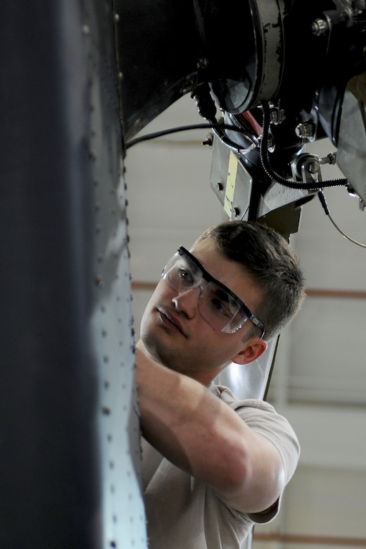 U.S. Air Force Airman Jordan Vignon, 362nd Training Squadron, 1st Detachment technical student, performs maintenance on a UH-60 Pave Hawk tail gear box during training at Fort Eustis, Va., Feb. 28, 2013. Approximately 115 Airmen come through the detachment doors annually to become skilled crew chiefs of the H-60 helicopters. (U.S. Air Force photo by Staff Sgt. Ashley Hawkins/Released)  