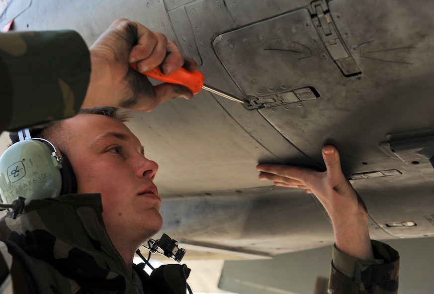 U.S. Air Force Airman 1st Class Kalib McBride, 23d Aircraft Maintenance Squadron crew chief, inspects an A-10C Thunderbolt II during a phase II operational readiness exercise Feb. 28, 2013, at Moody Air Force Base, Ga. McBride executed the post-flight inspection to ensure the aircraft was ready to go when needed. (U.S. Air Force photo by Airman Alexis Grotz/Released) 