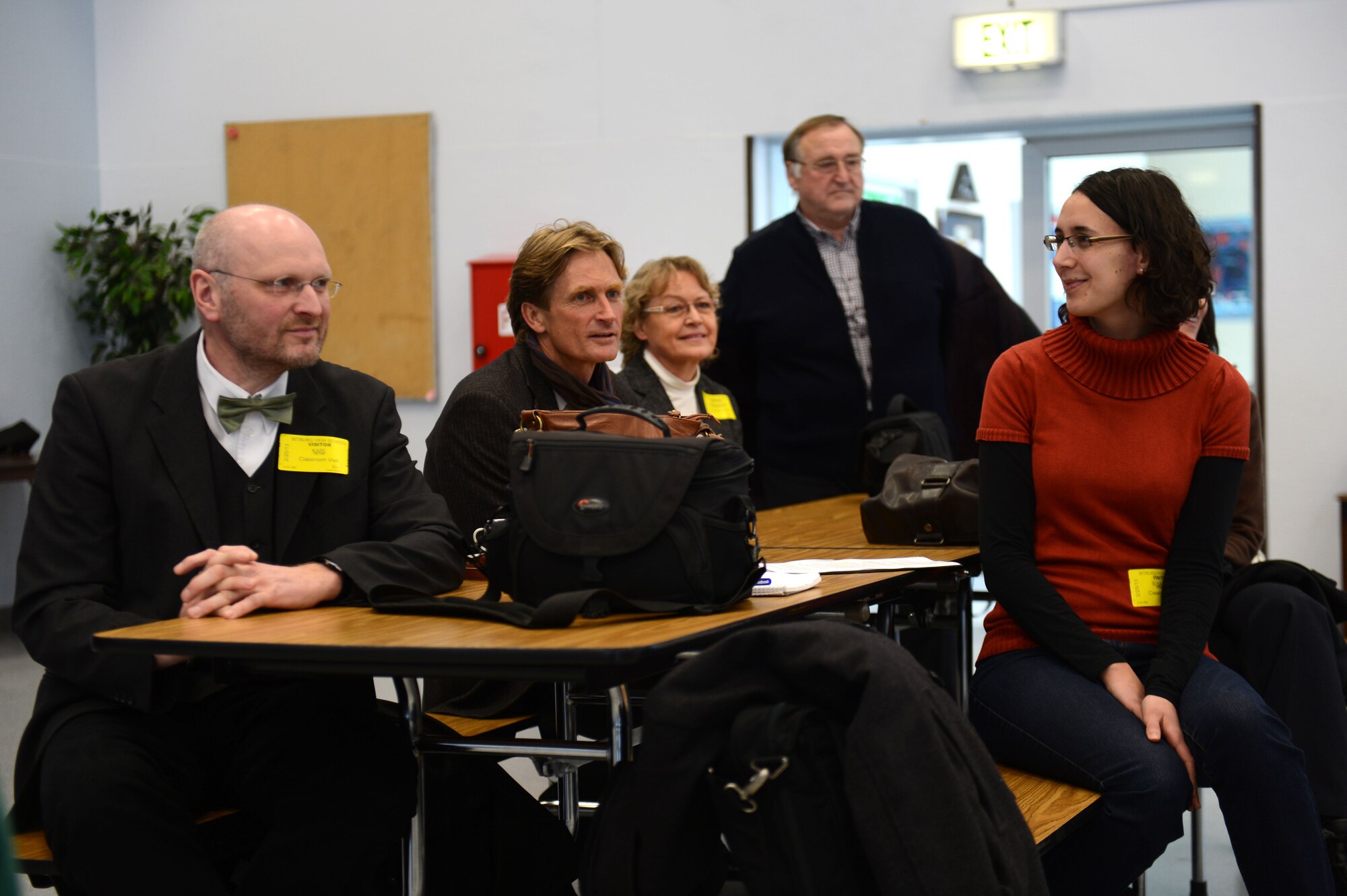 BITBURG, Germany – Teachers from St.-Willibrord-Gymnasium, along with members of the Host Nation Council sit in the Bitburg High School cafeteria during a school exchange program Feb. 25, 2013.  The teachers from St.-Willibrord-Gymnasium, the German equivalent of an American high school, joined the students on a tour throughout the BHS campus to experience a day in the life of an American student. (U.S. Air Force photo by Airman 1st Class Gustavo Castillo/Released)