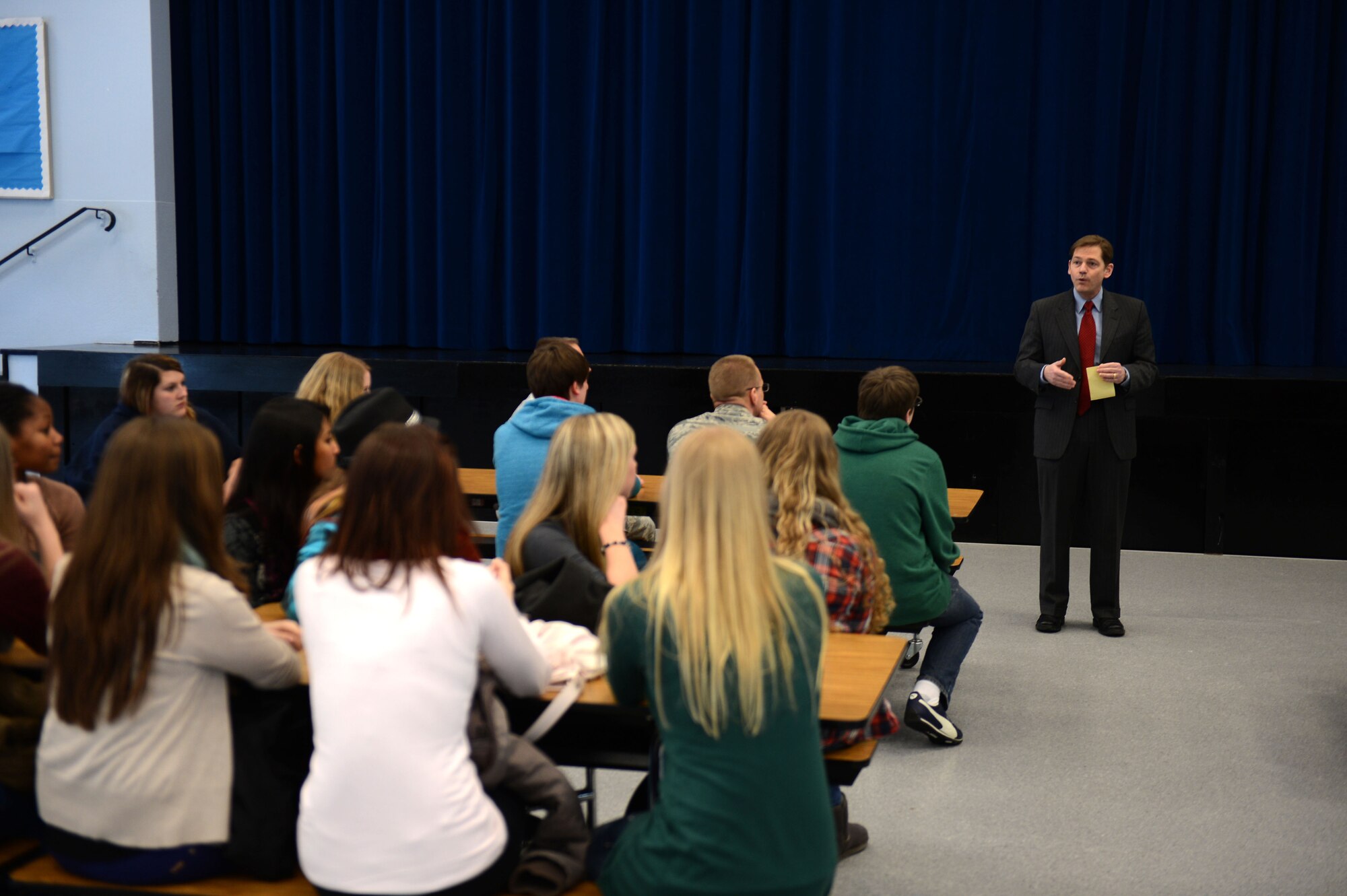 BITBURG, Germany – Patrick Gross, Bitburg High School principal, speaks with American and German students during an assembly as part of a school exchange program at BHS Feb. 25, 2013. Students from St.-Willibrord-Gymnasium, the German equivalent of an American high school, visited BHS to learn about the American education system and culture. (U.S. Air Force photo by Airman 1st Class Gustavo Castillo/Released)