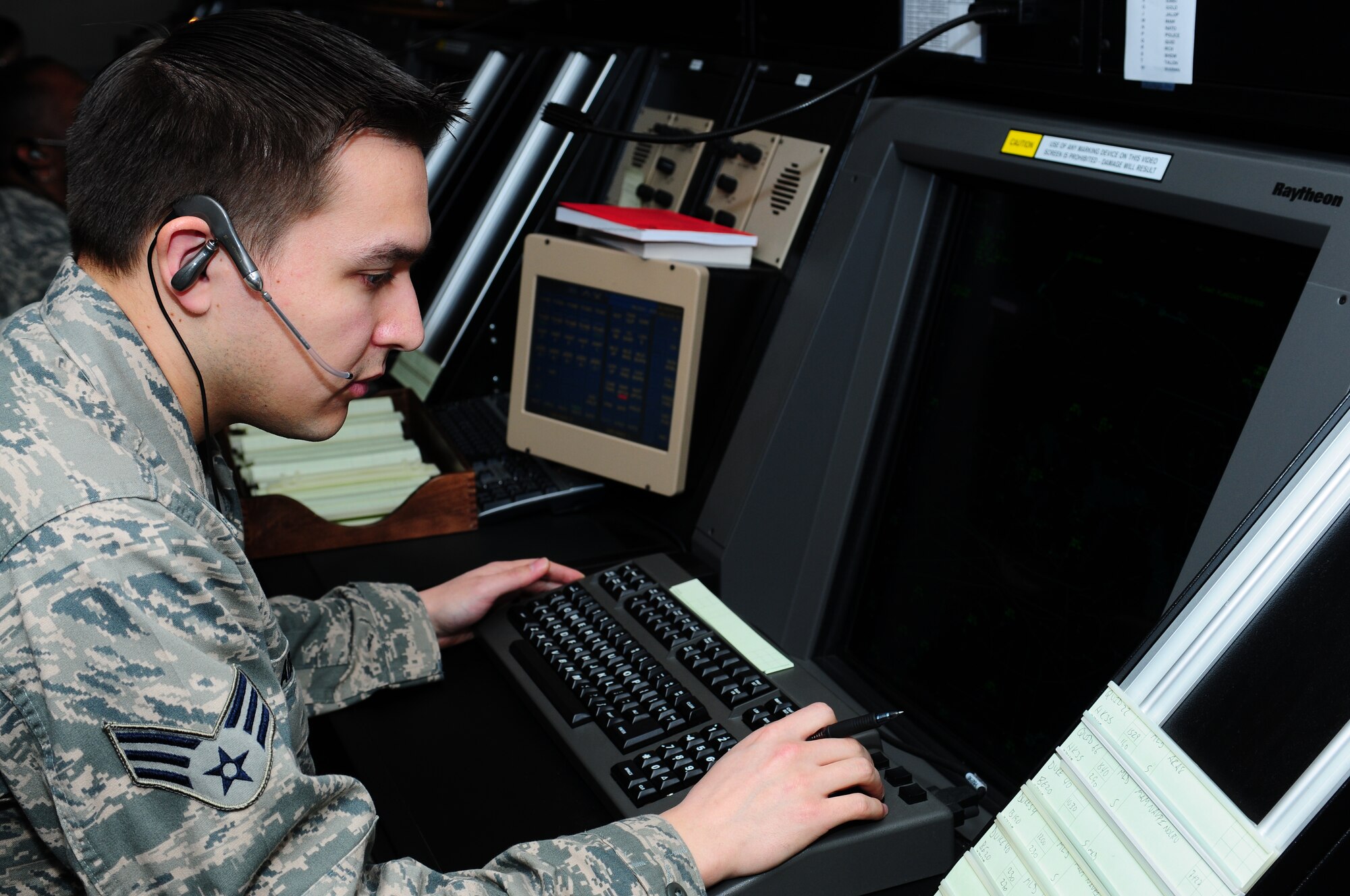 ROYAL AIR FORCE LAKENHEATH, England -- Senior Airman Denny Adkinson, 48th Operations Support Squadron air traffic controller, helps coordinate the flow of air traffic Jan. 29, 2013. Adkinson was nominated for a Liberty Spotlight, because he displays the core value of "Excellence in All We Do." (U.S. Air Force photo by Airman 1st Class Dana Butler) 