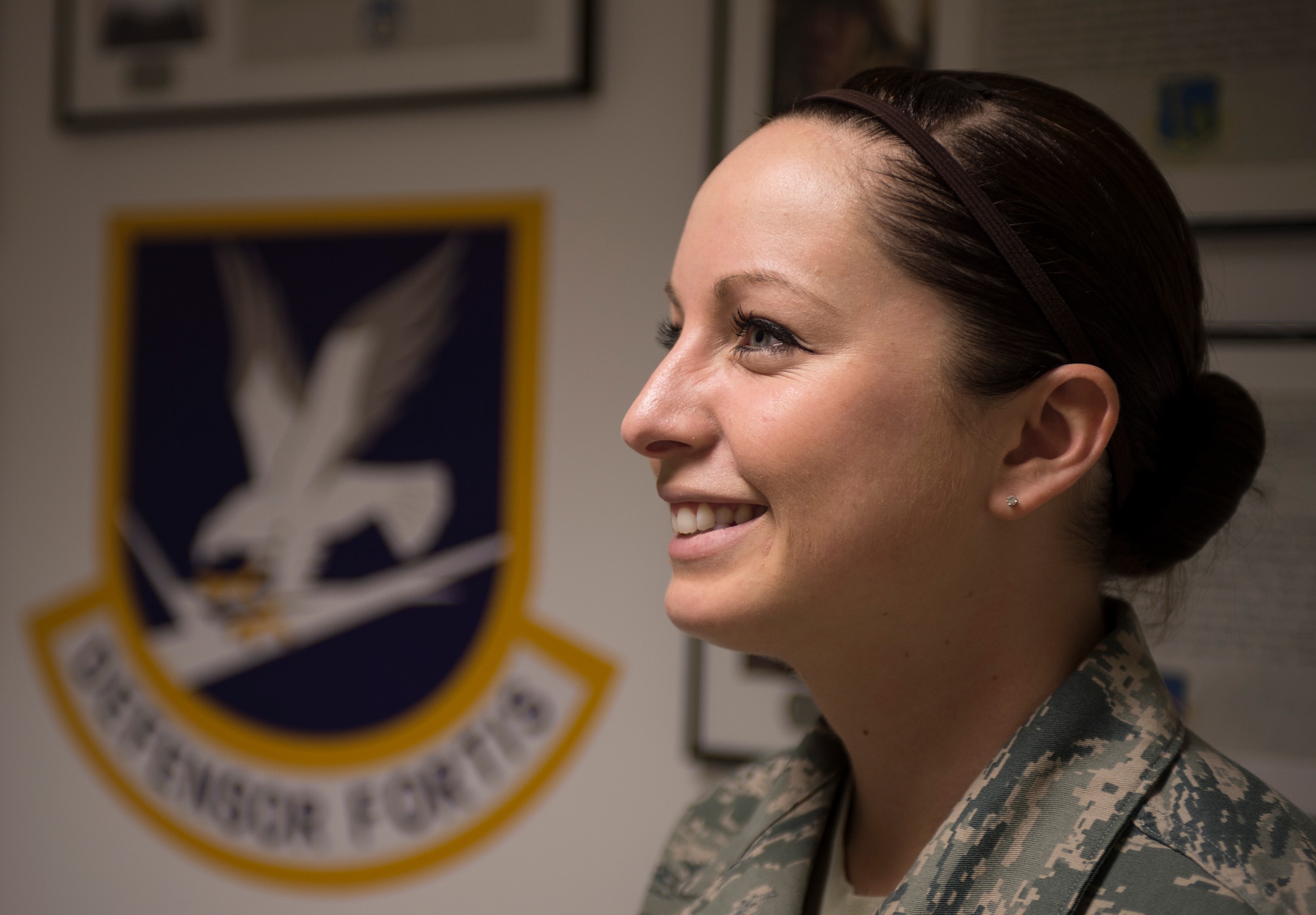 SPANDGDAHLEM AIR BASE, Germany -- U.S. Air Force Senior Airman Lindsey Mahfouz, 52nd Security Forces Squadron member from Lincoln, Calif., stand in front of the 52nd SFS Fallen Defenders Memorial March 1, 2013. Mahfouz designed and arranged the construction of the memorial with the help of fellow 52nd members. The memorial honors nine security forces Airmen who died in the line of duty after 9/11. (U.S. Air Force photo by Senior Airman Natasha Stannard/Released)