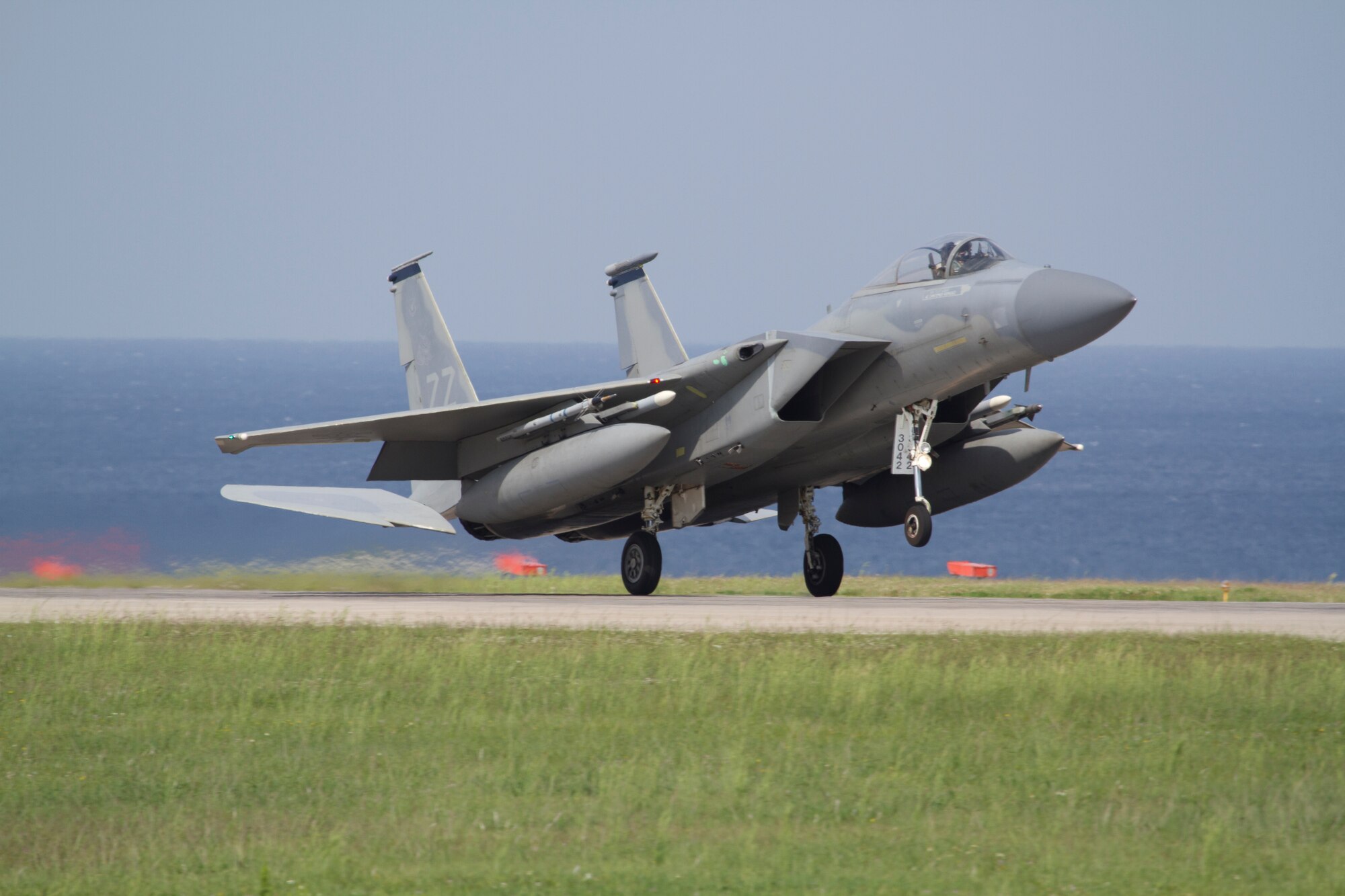 A 44th Fighter Squadron F-15 Eagle fighter aircraft takes off from Kadena Air Base, Japan. The 44th FS was recently awarded the Raytheon Trophy for 2012. Presented annually since 1953, the Raytheon trophy is awarded to the top air-superiority or air-defense squadron in the Air Force. (Courtesy photo by Jake Melampy)